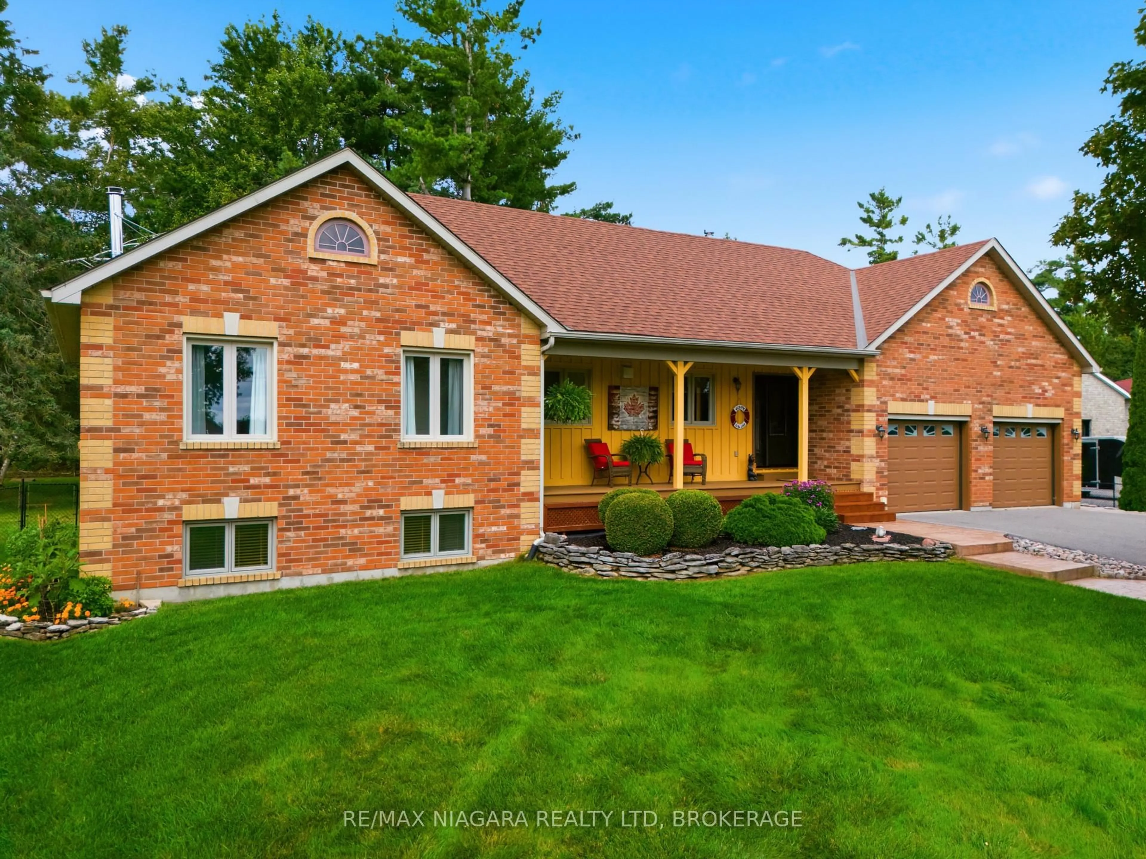 Home with brick exterior material, street for 115 Pinewood Blvd, Kawartha Lakes Ontario K0M 2T0