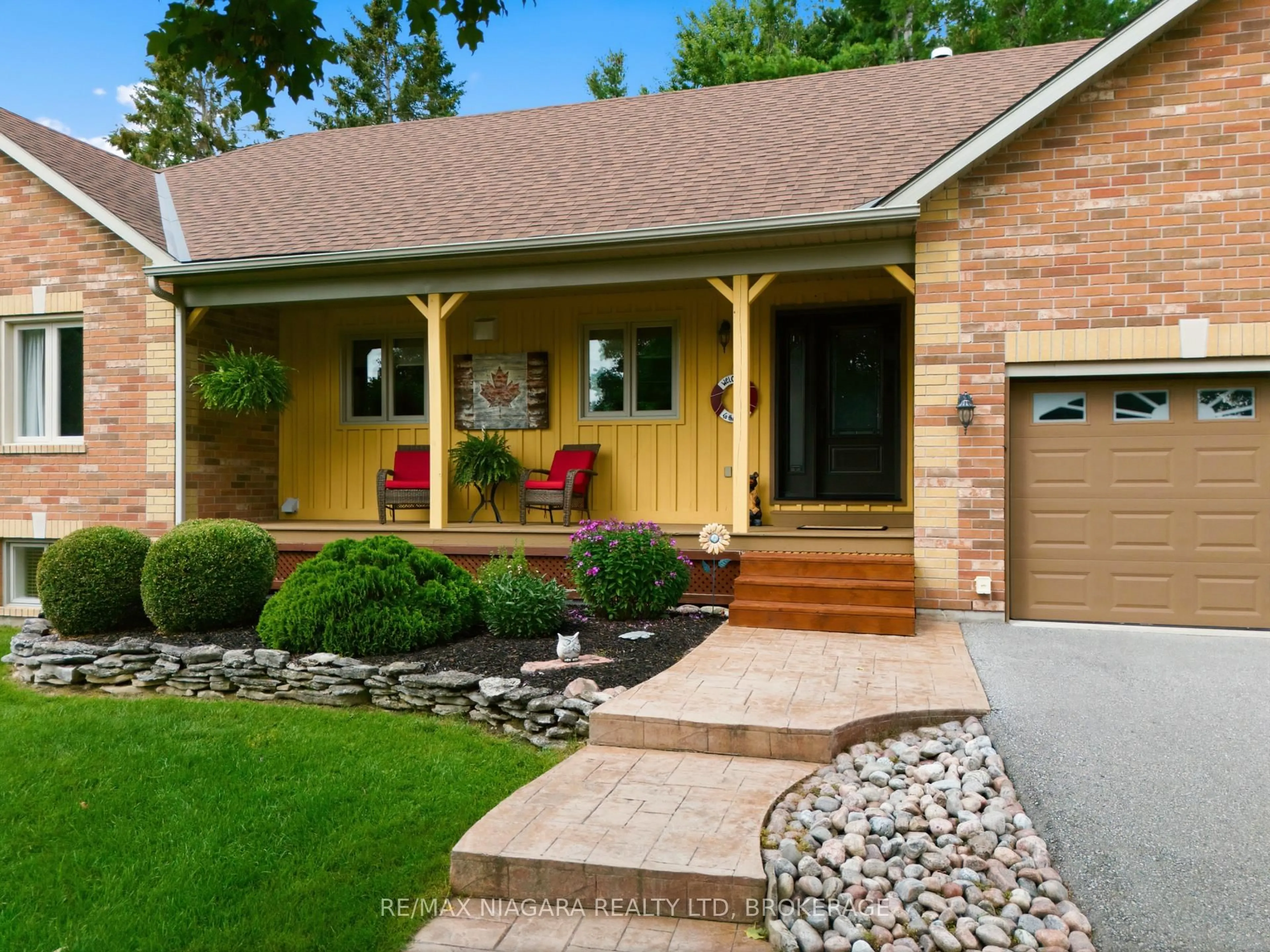 Home with brick exterior material, street for 115 Pinewood Blvd, Kawartha Lakes Ontario K0M 2T0
