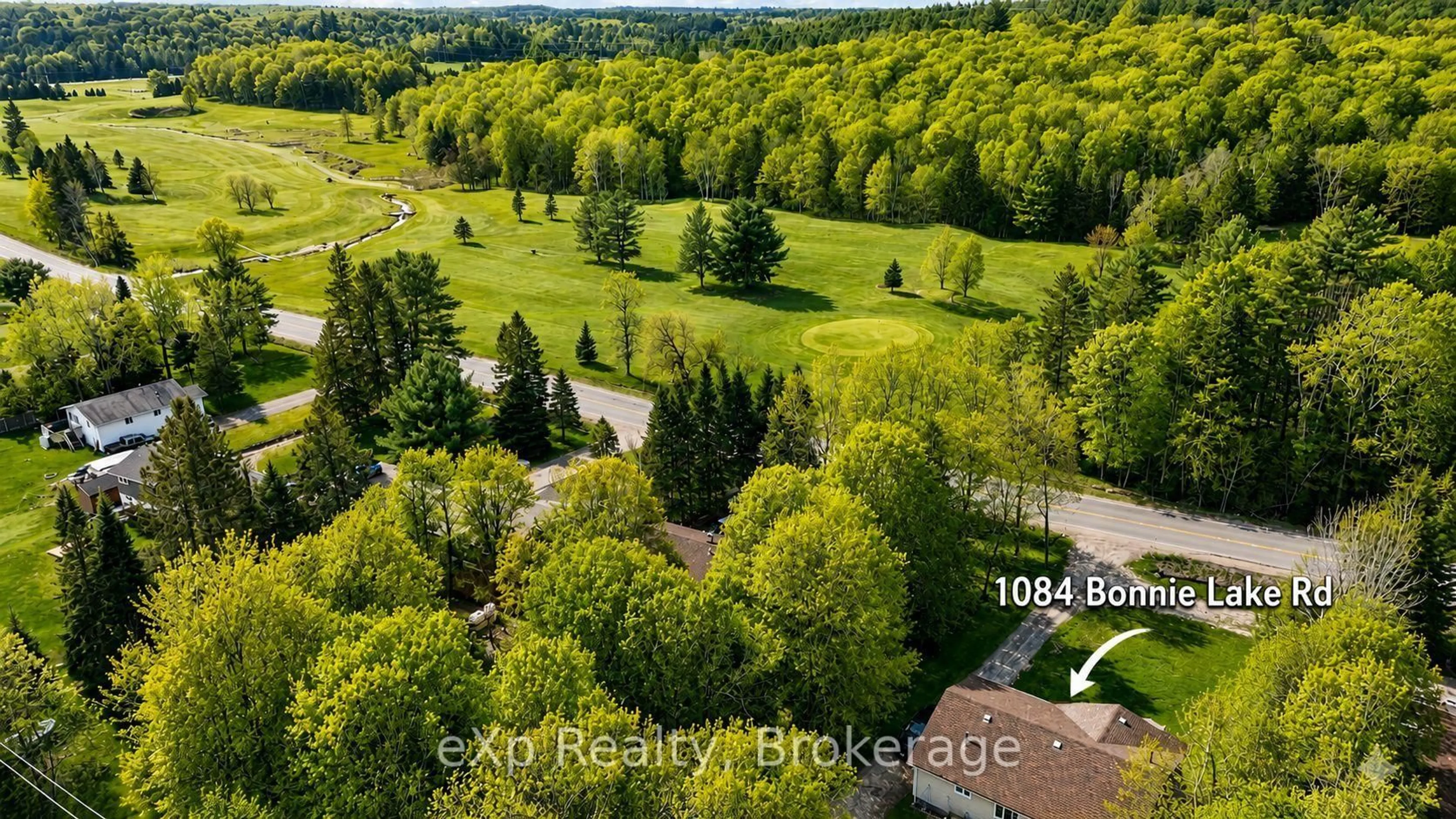 A pic from outside/outdoor area/front of a property/back of a property/a pic from drone, forest/trees view for 1084 Bonnie Lake Rd, Bracebridge Ontario P1L 1W9