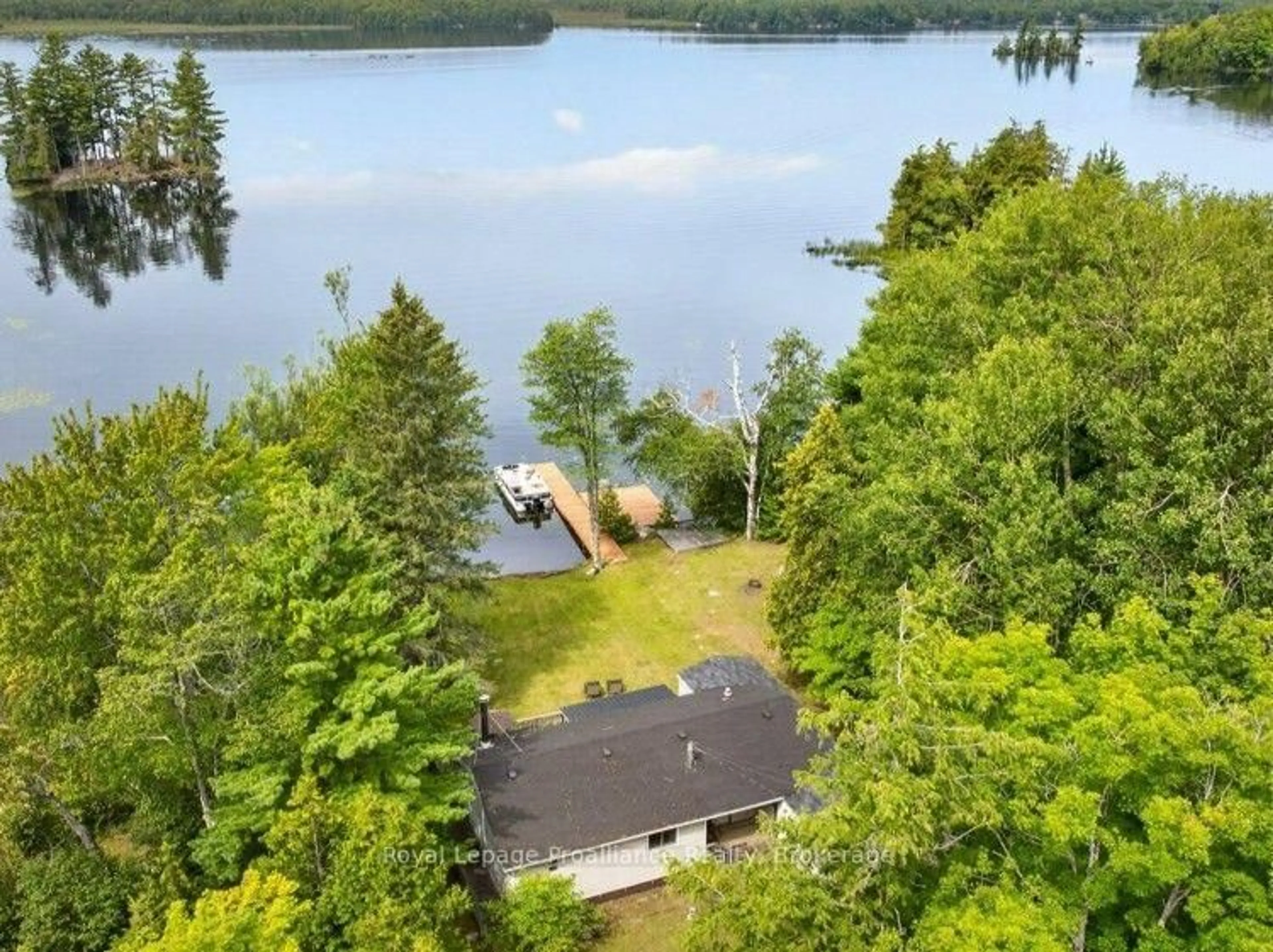 A pic from outside/outdoor area/front of a property/back of a property/a pic from drone, water/lake/river/ocean view for 1693 Gull Lake Rd, Arden Ontario K0H 1B0