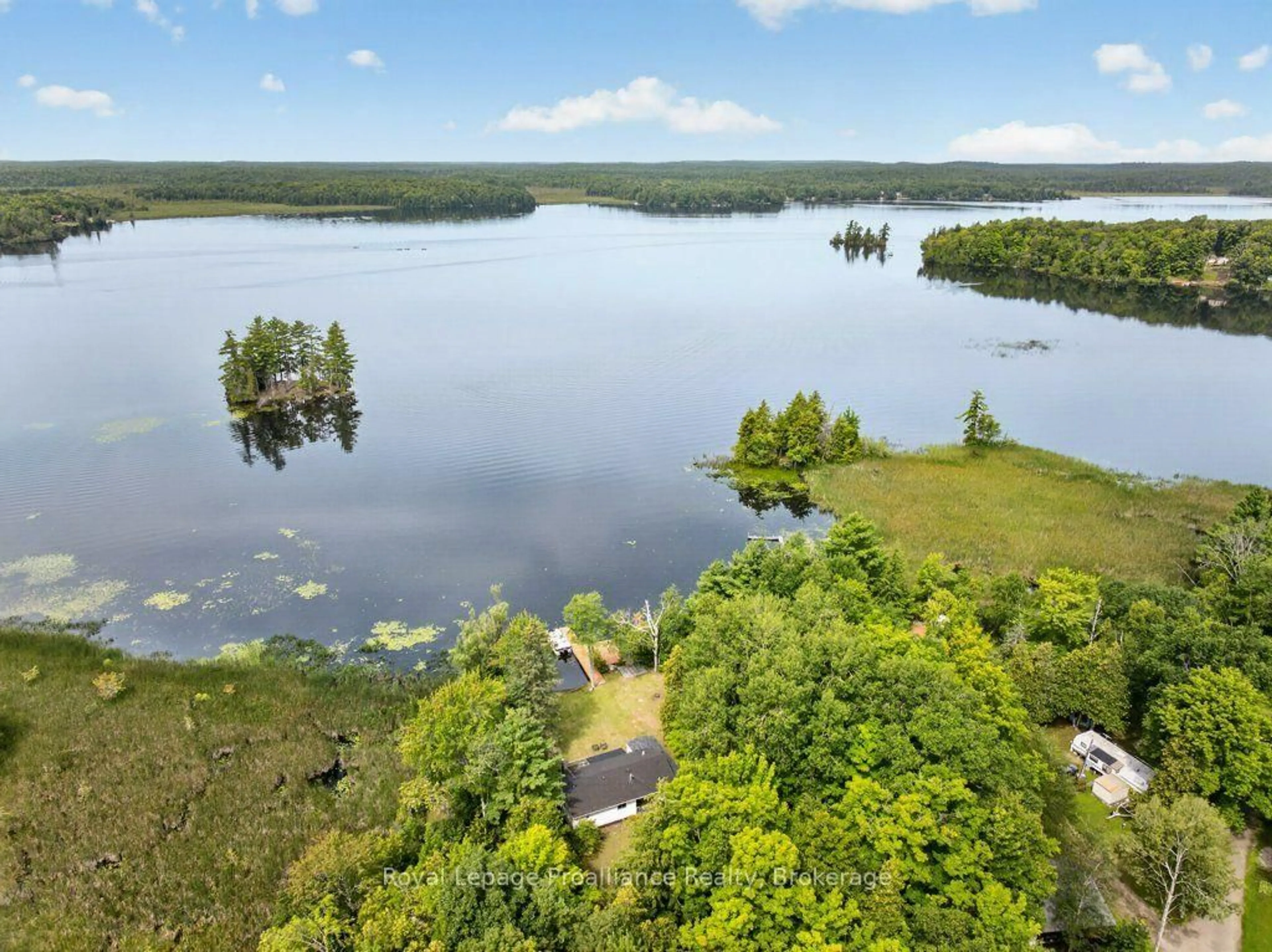 A pic from outside/outdoor area/front of a property/back of a property/a pic from drone, water/lake/river/ocean view for 1693 Gull Lake Rd, Arden Ontario K0H 1B0