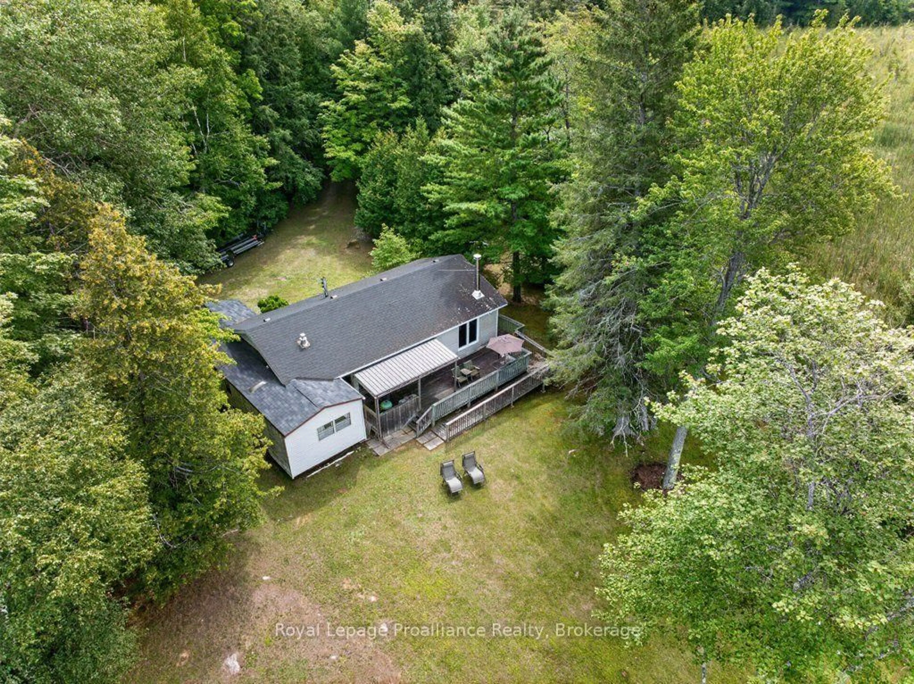 A pic from outside/outdoor area/front of a property/back of a property/a pic from drone, forest/trees view for 1693 Gull Lake Rd, Arden Ontario K0H 1B0