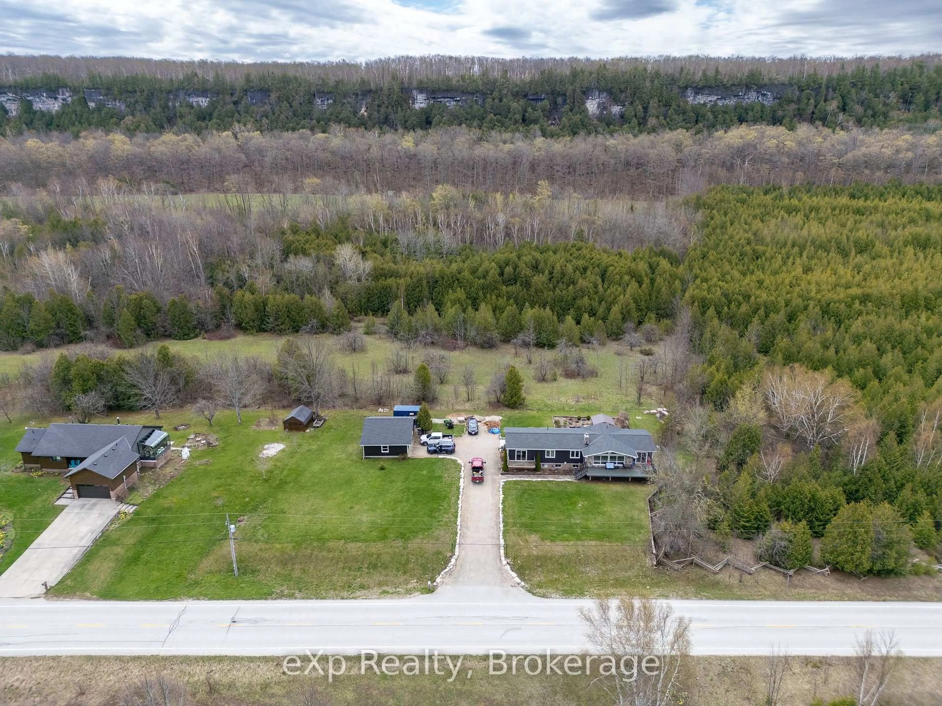 A pic from outside/outdoor area/front of a property/back of a property/a pic from drone, forest/trees view for 502754 Grey Road 1, Georgian Bluffs Ontario N0H 2T0