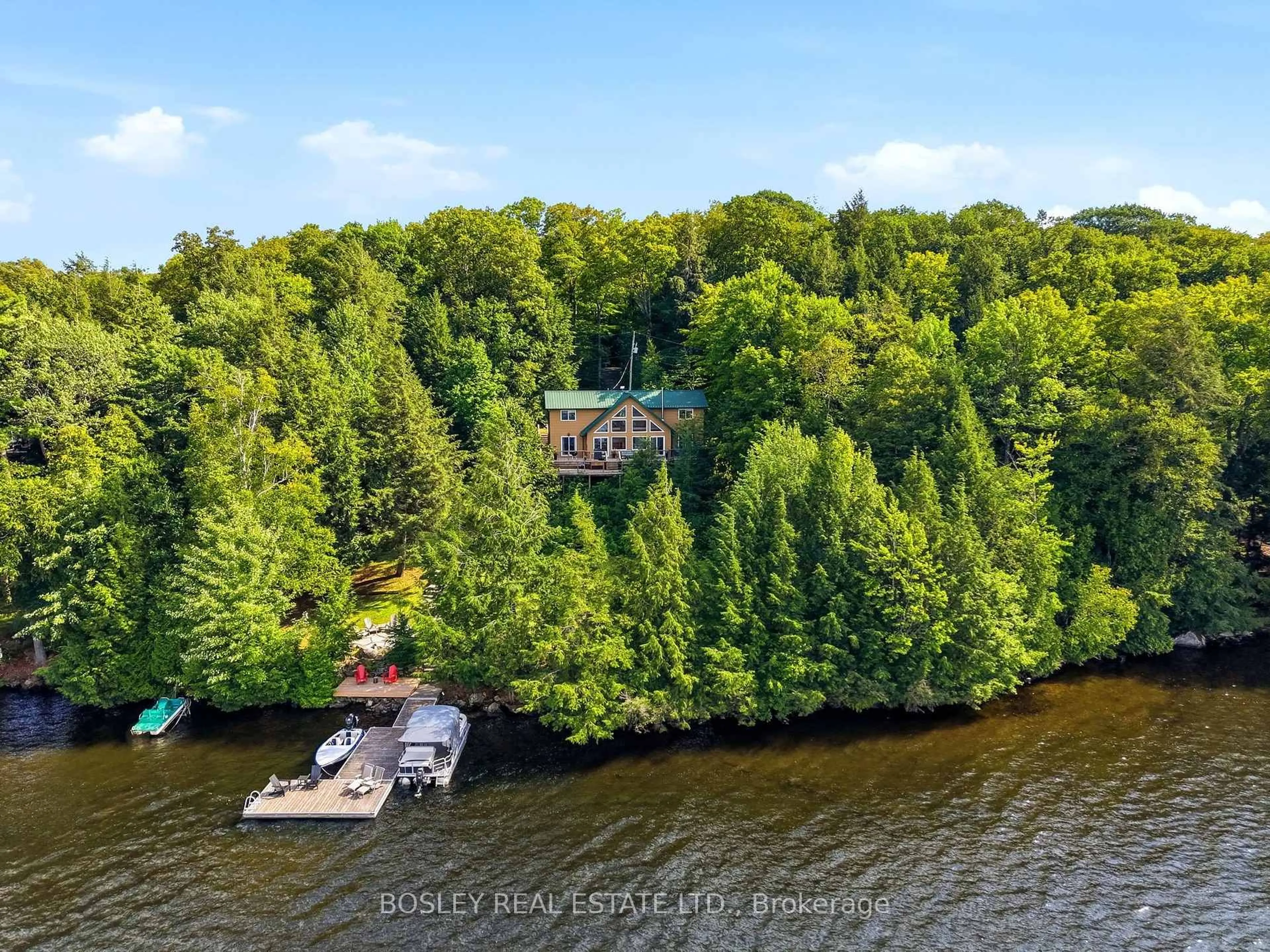 A pic from outside/outdoor area/front of a property/back of a property/a pic from drone, water/lake/river/ocean view for 1143 Rignalls Rd, Bracebridge Ontario P1L 1X1