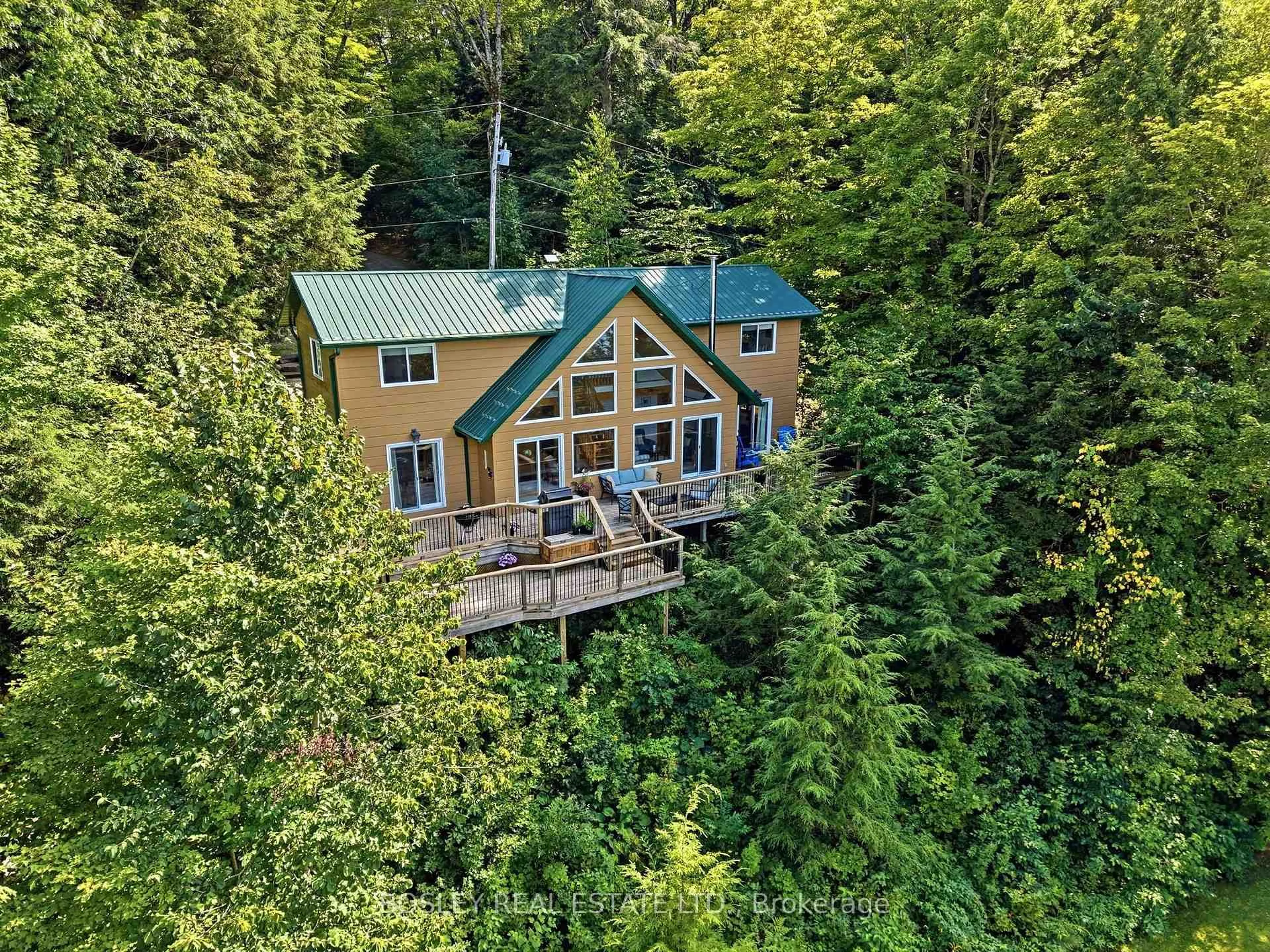 A pic from outside/outdoor area/front of a property/back of a property/a pic from drone, forest/trees view for 1143 Rignalls Rd, Bracebridge Ontario P1L 1X1