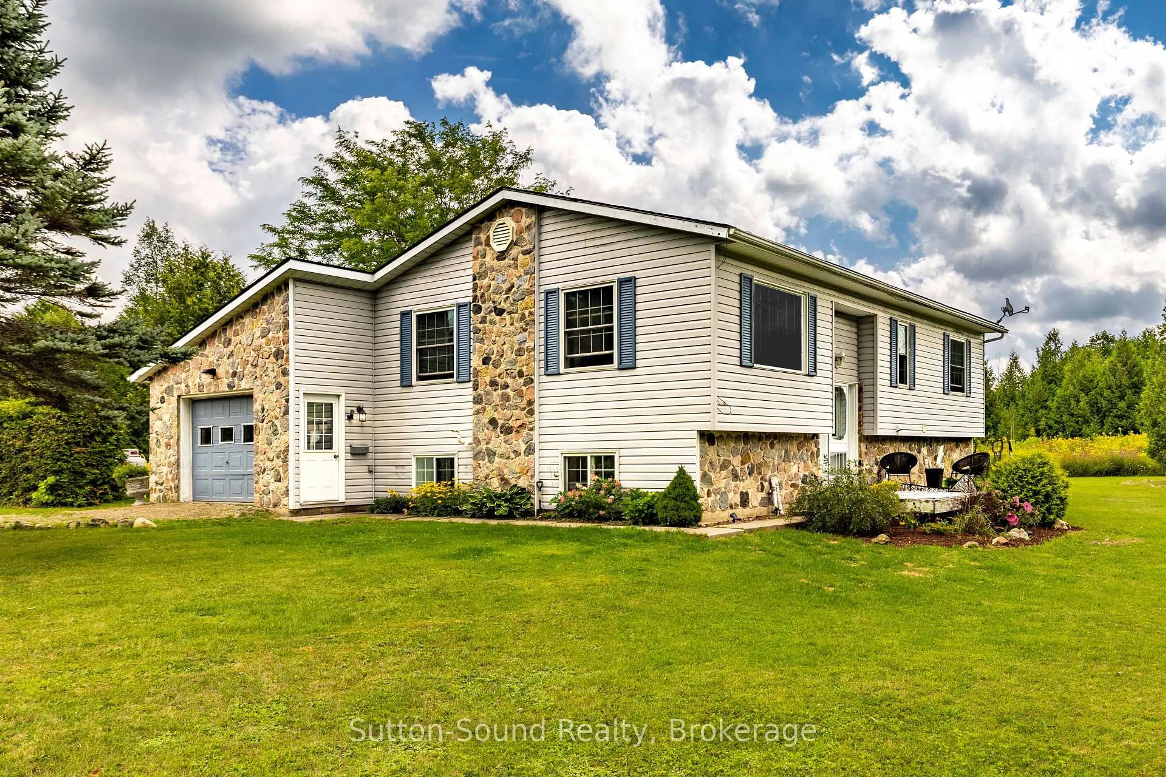 Home with vinyl exterior material, street for 300394 Grey Road 170 Rd, Georgian Bluffs Ontario N0H 2K0