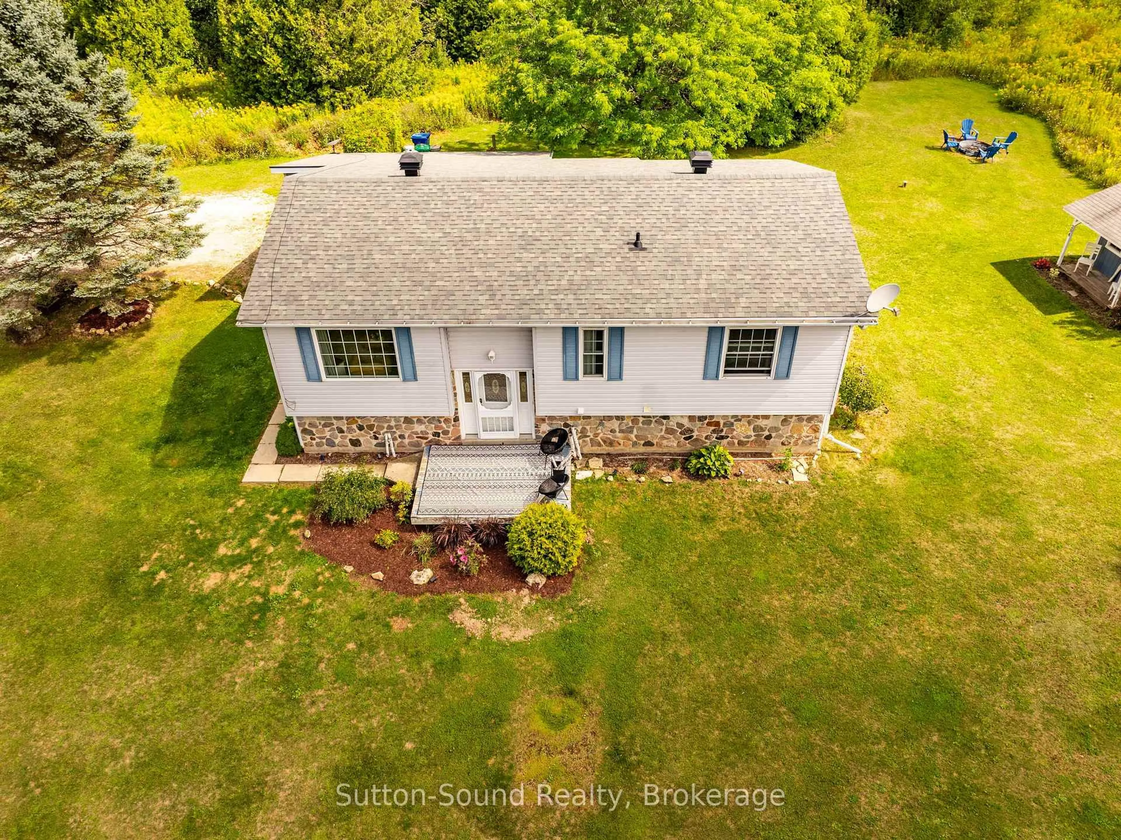 A pic from outside/outdoor area/front of a property/back of a property/a pic from drone, unknown for 300394 Grey Road 170 Rd, Georgian Bluffs Ontario N0H 2K0