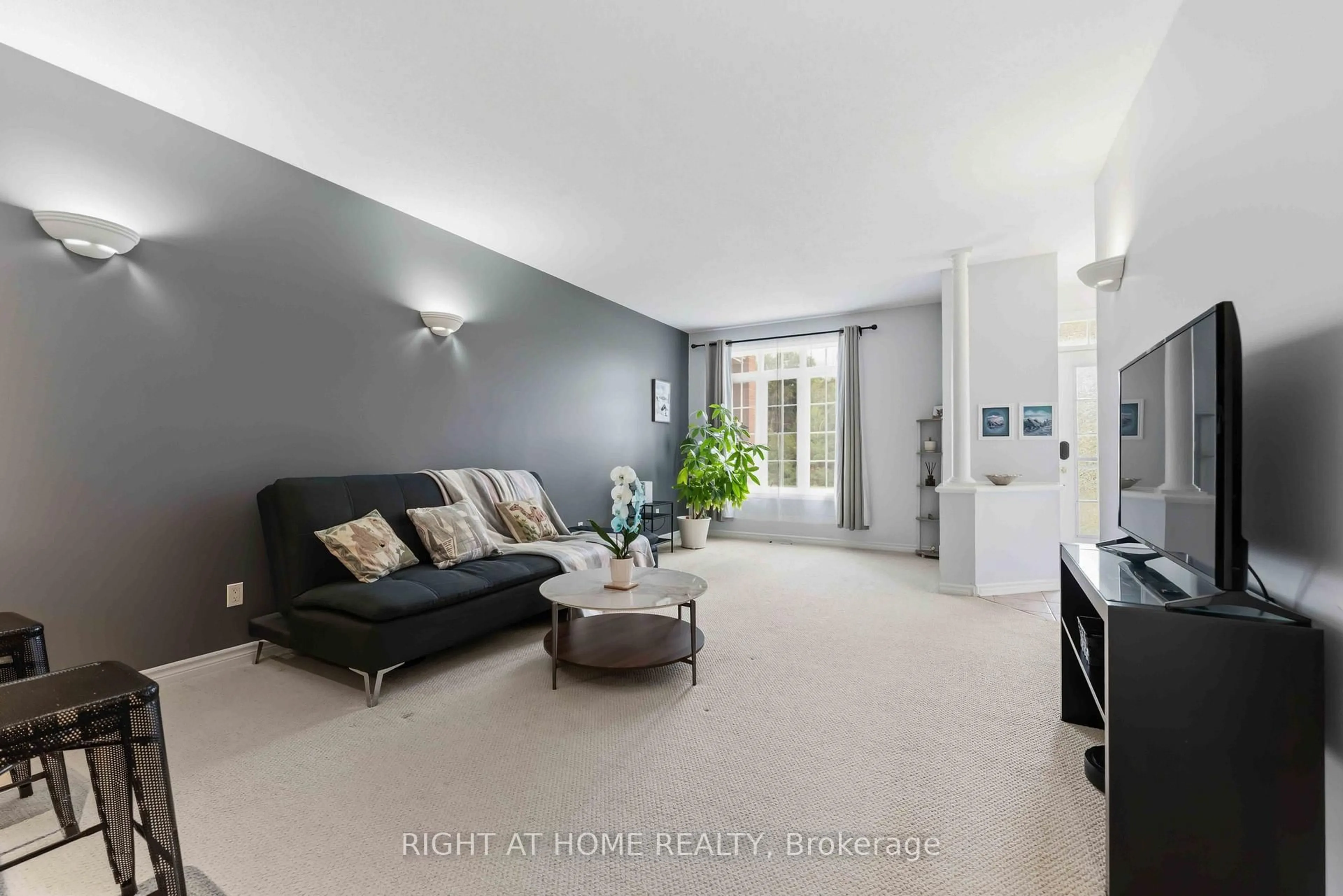 Living room with furniture, unknown for 1745 Campeau Dr #106, Ottawa Ontario K2K 0A2