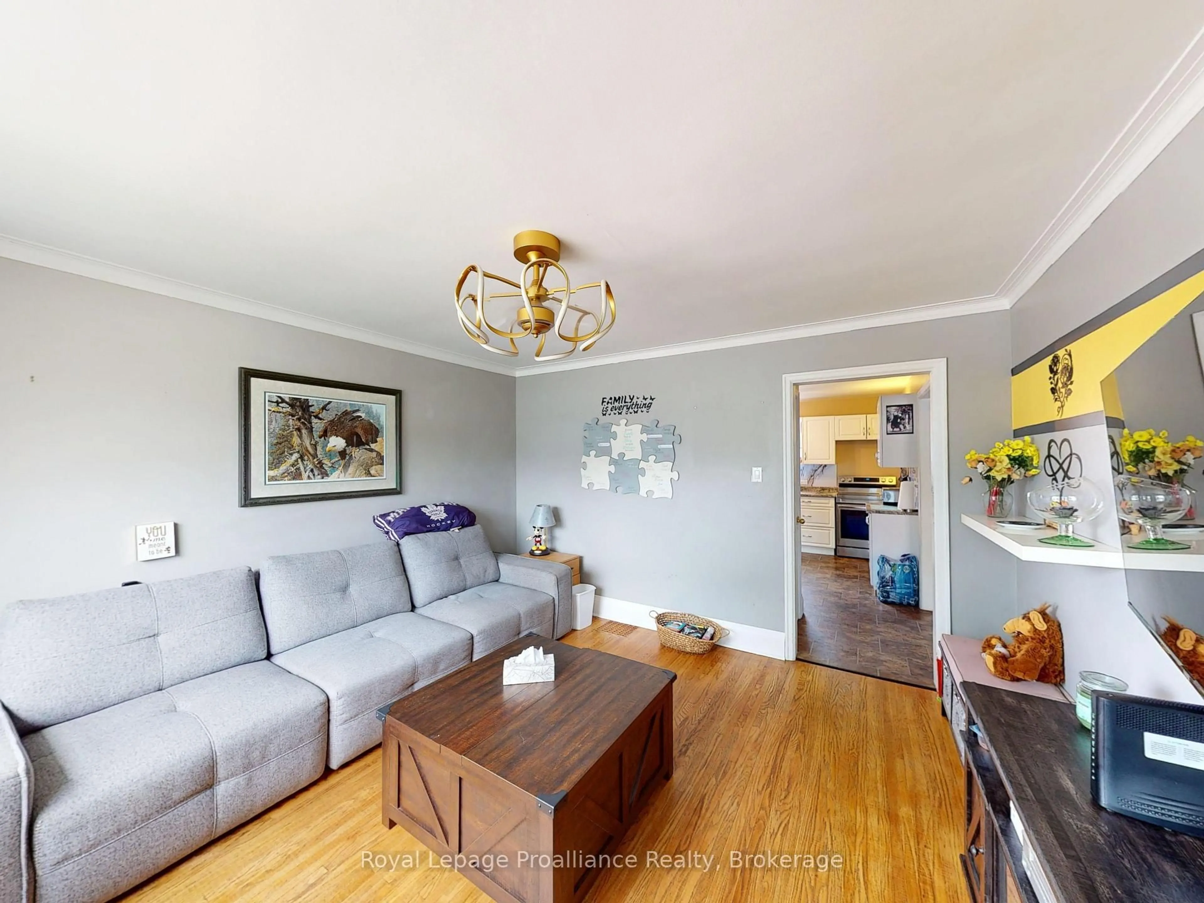 Living room with furniture, wood/laminate floor for 163 Shuter St, Quinte West Ontario K8V 3L9