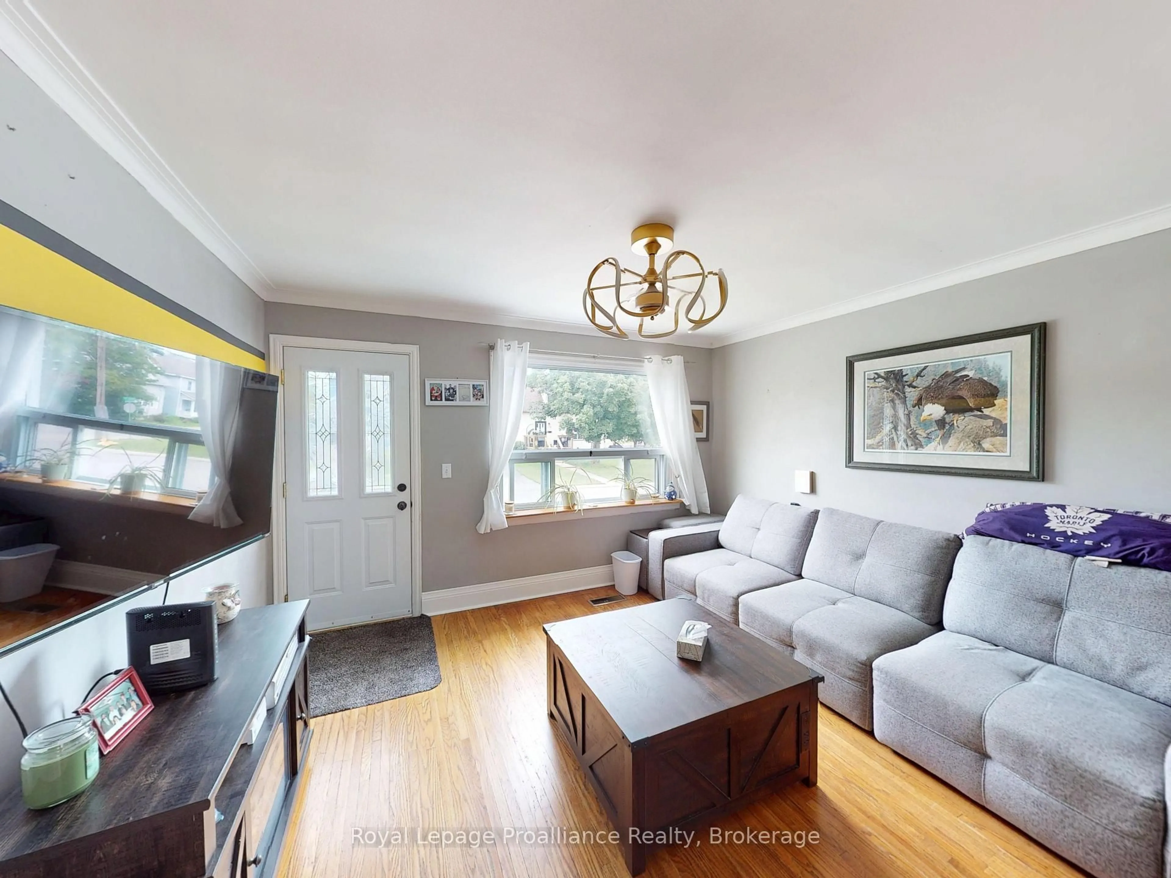 Living room with furniture, wood/laminate floor for 163 Shuter St, Quinte West Ontario K8V 3L9