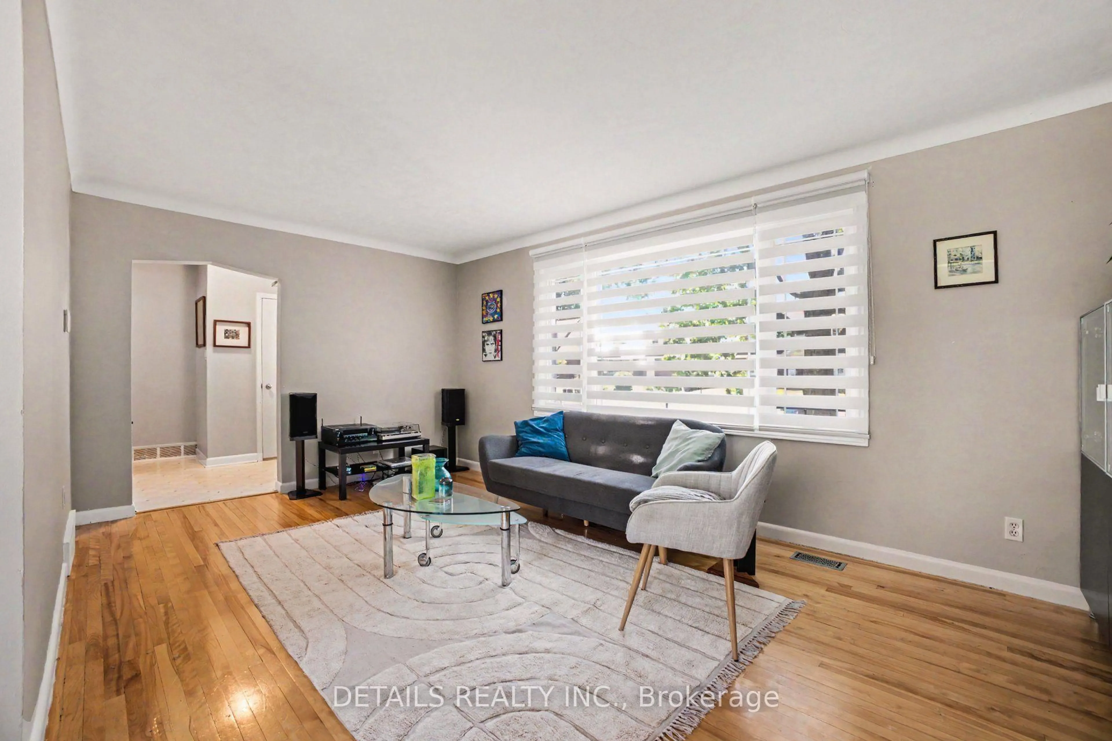 Living room with furniture, wood/laminate floor for 1233 Checkers Rd, Ottawa Ontario K2C 2S8