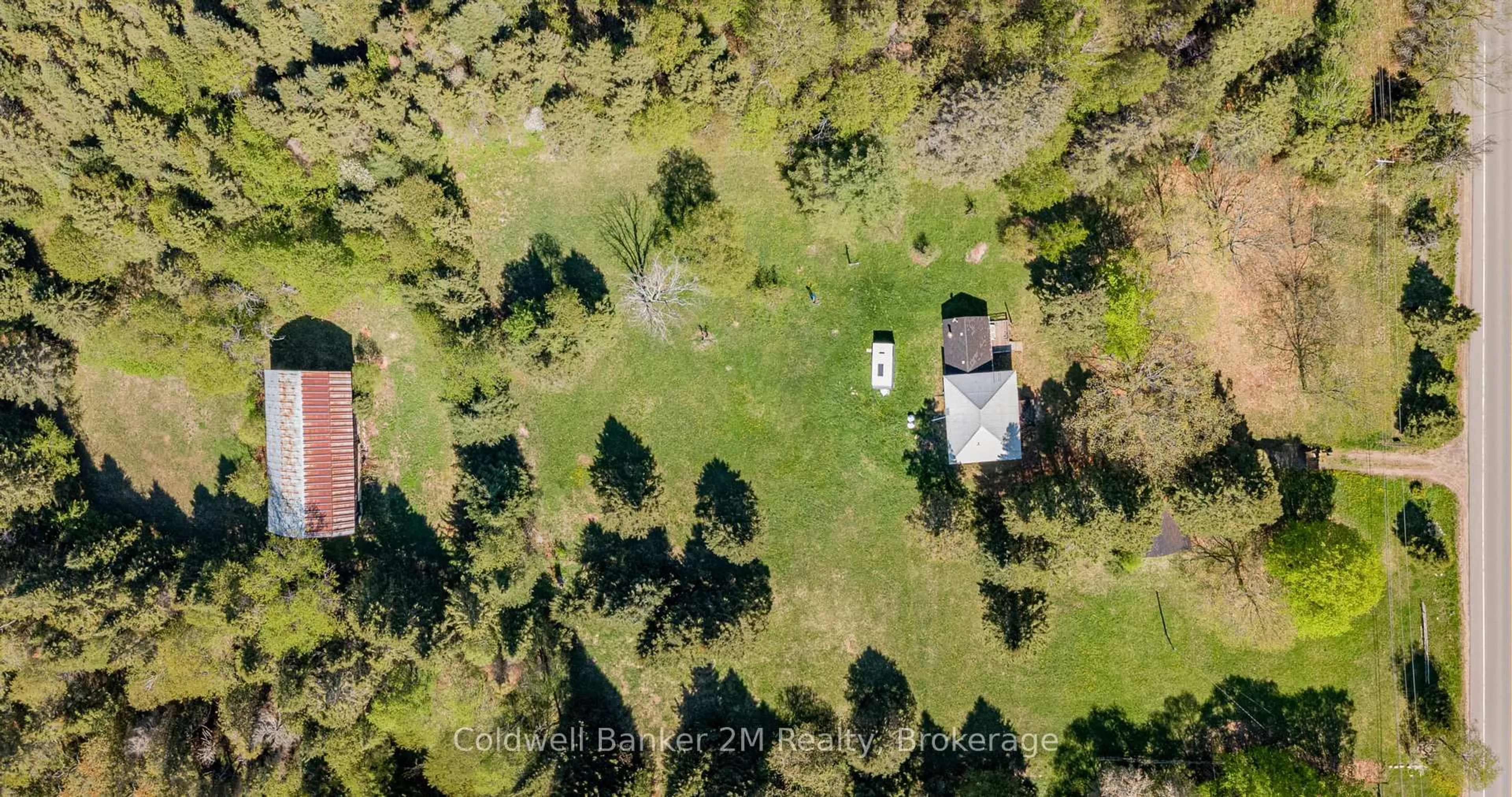 A pic from outside/outdoor area/front of a property/back of a property/a pic from drone, forest/trees view for 18917 Highway 118, Highlands East Ontario K0L 2Y0