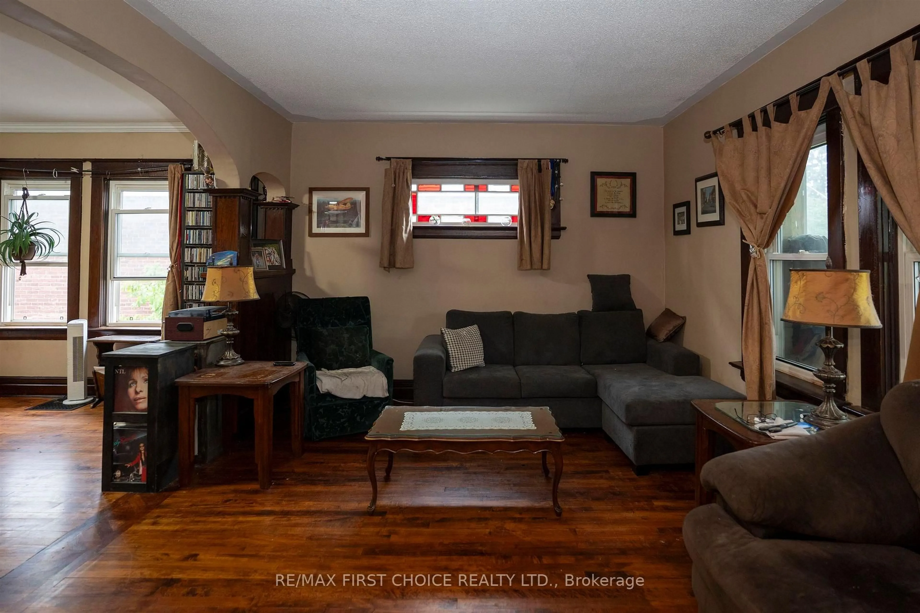 Living room with furniture, wood/laminate floor for 308 Archibald St, Thunder Bay Ontario P7C 3Y4