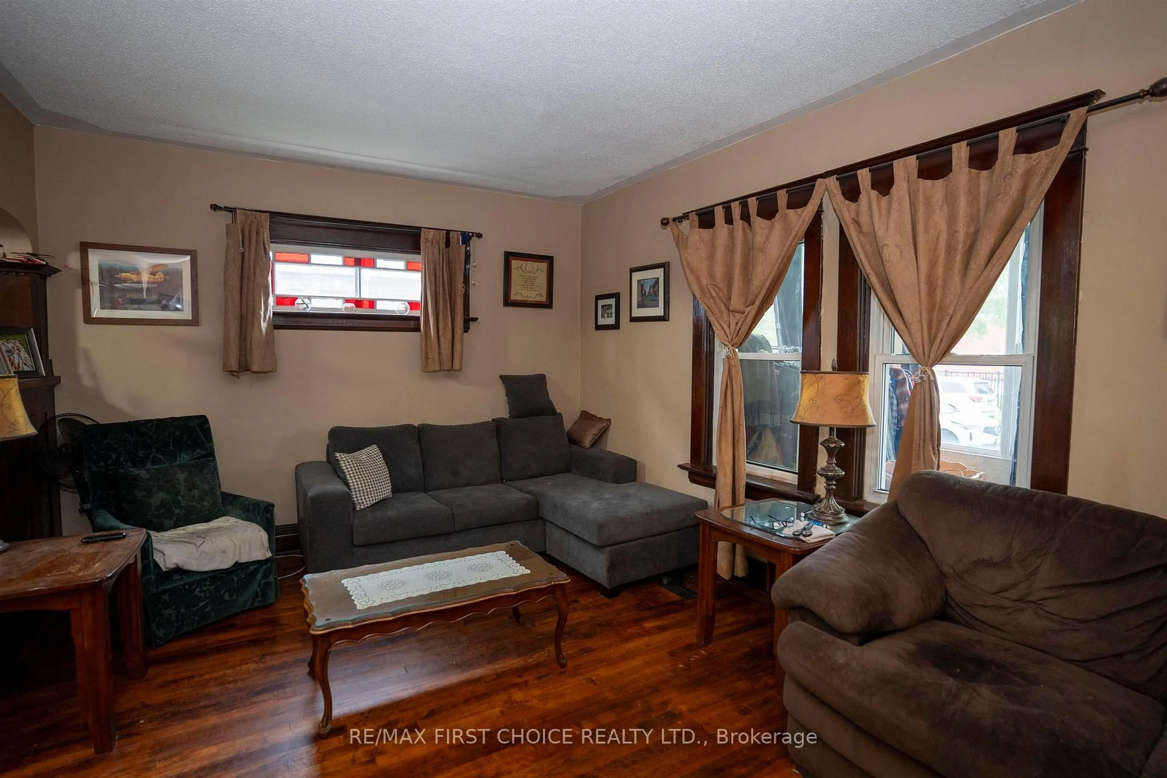 Living room with furniture, wood/laminate floor for 308 Archibald St, Thunder Bay Ontario P7C 3Y4