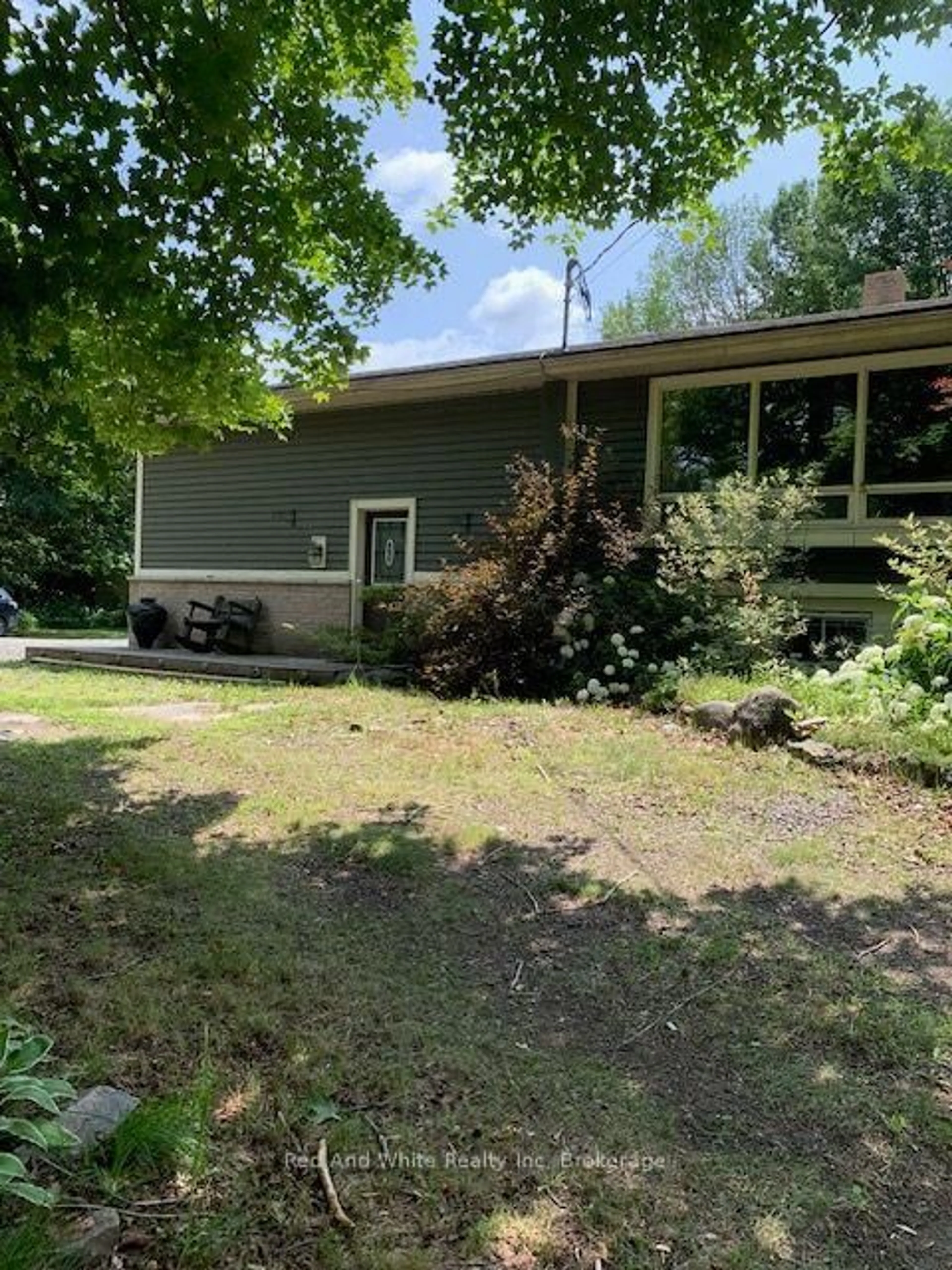 A pic from outside/outdoor area/front of a property/back of a property/a pic from drone, unknown for 708 141 HWY Highway, Seguin Ontario P0A 1J0