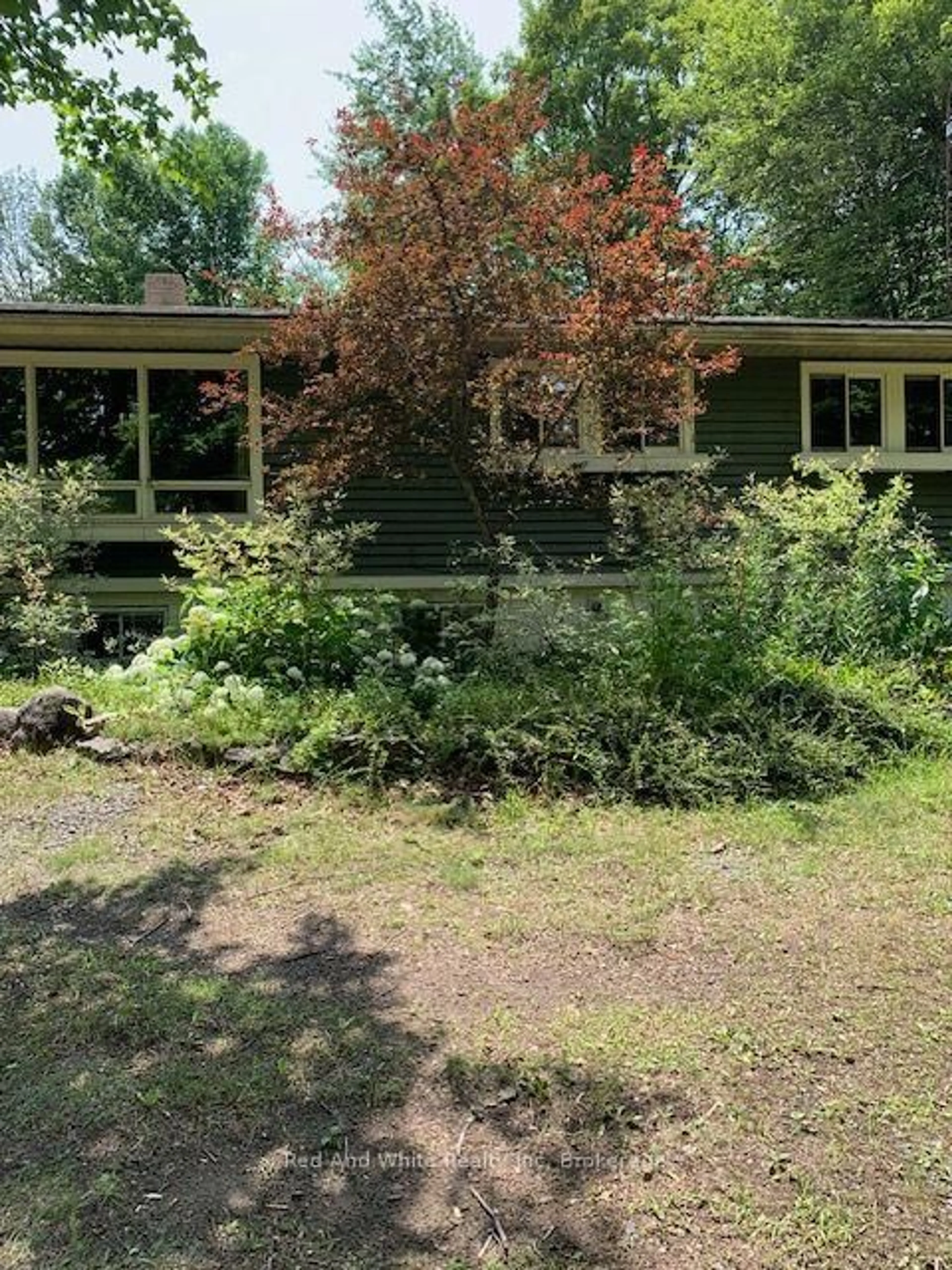 A pic from outside/outdoor area/front of a property/back of a property/a pic from drone, unknown for 708 141 HWY Highway, Seguin Ontario P0A 1J0
