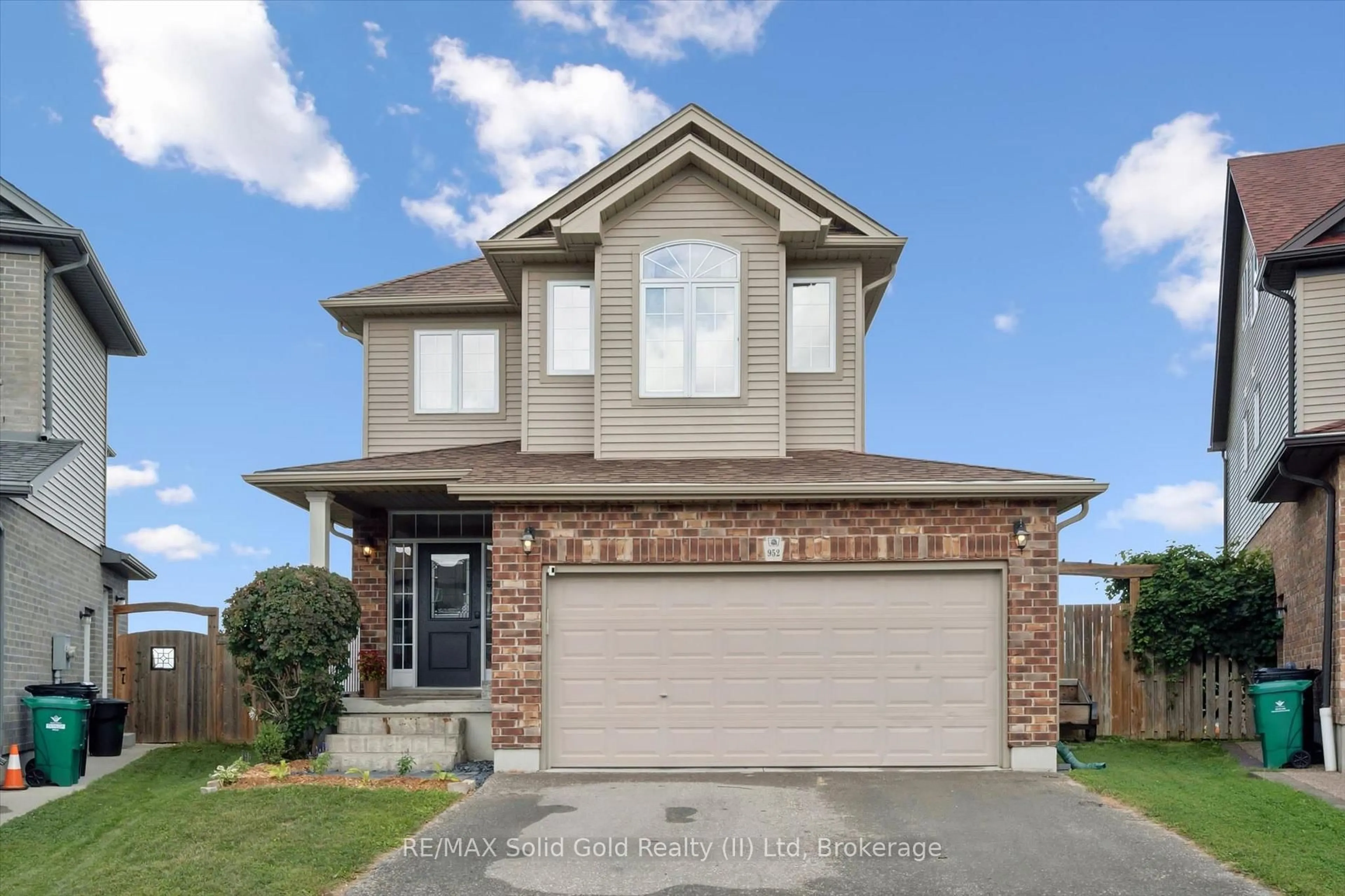 Home with brick exterior material, street for 952 Eden Oak Crt, Kitchener Ontario N2A 0C6