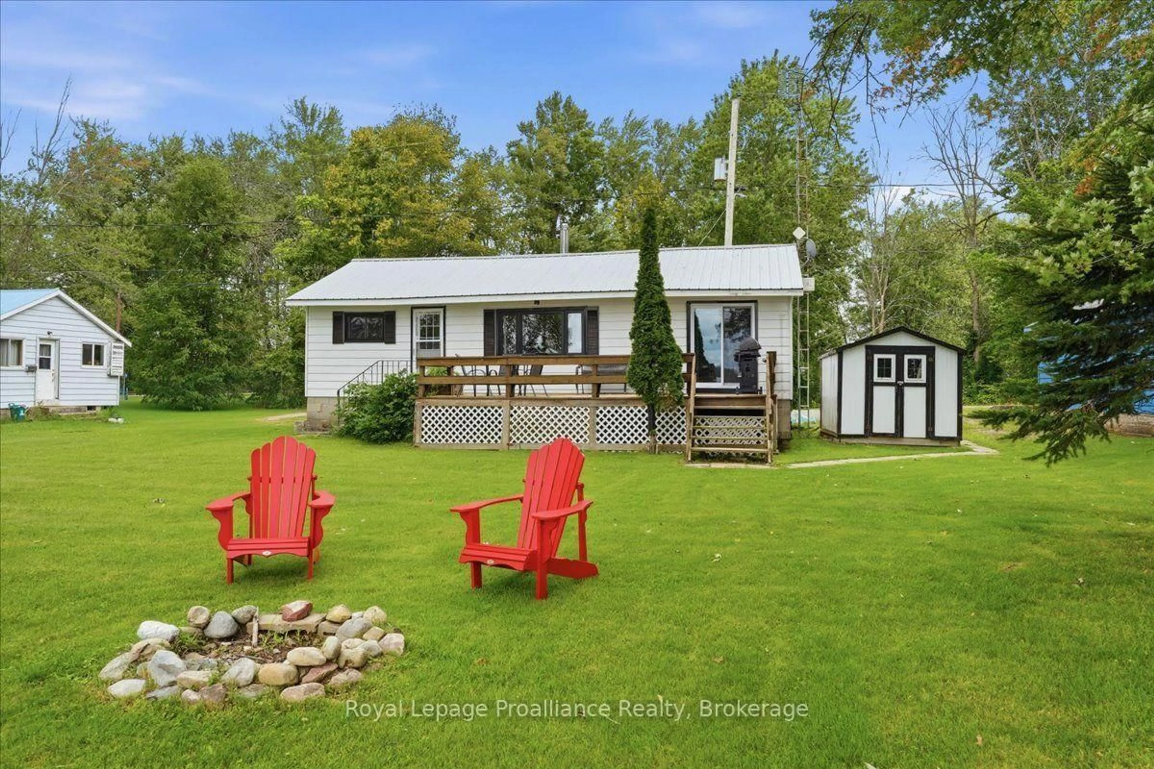 A pic from outside/outdoor area/front of a property/back of a property/a pic from drone, water/lake/river/ocean view for 133 Hughes Lane, Tweed Ontario K0K 3J0