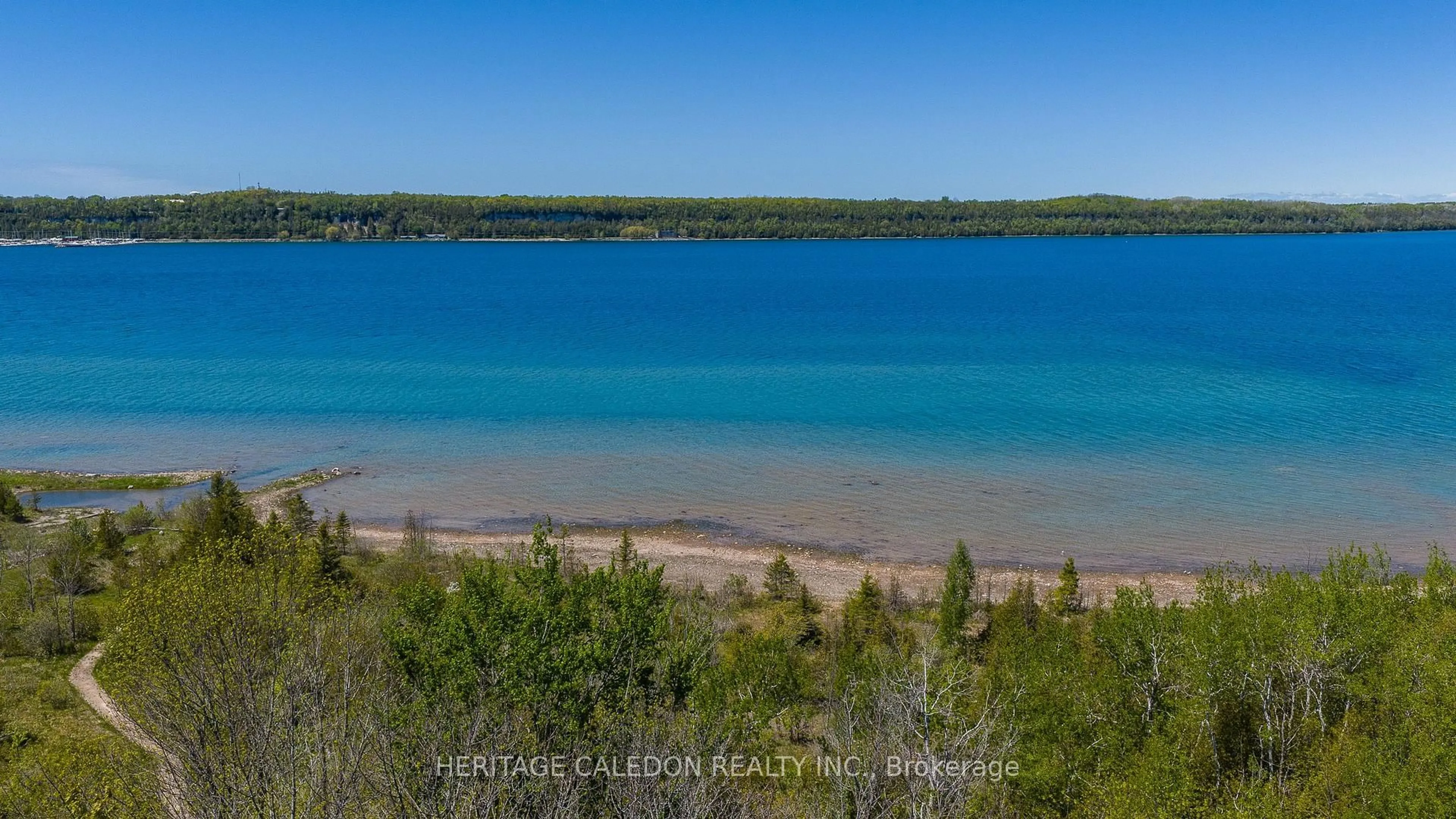 A pic from outside/outdoor area/front of a property/back of a property/a pic from drone, water/lake/river/ocean view for 501241 Grey Rd 1, Georgian Bluffs Ontario N0H 2T0