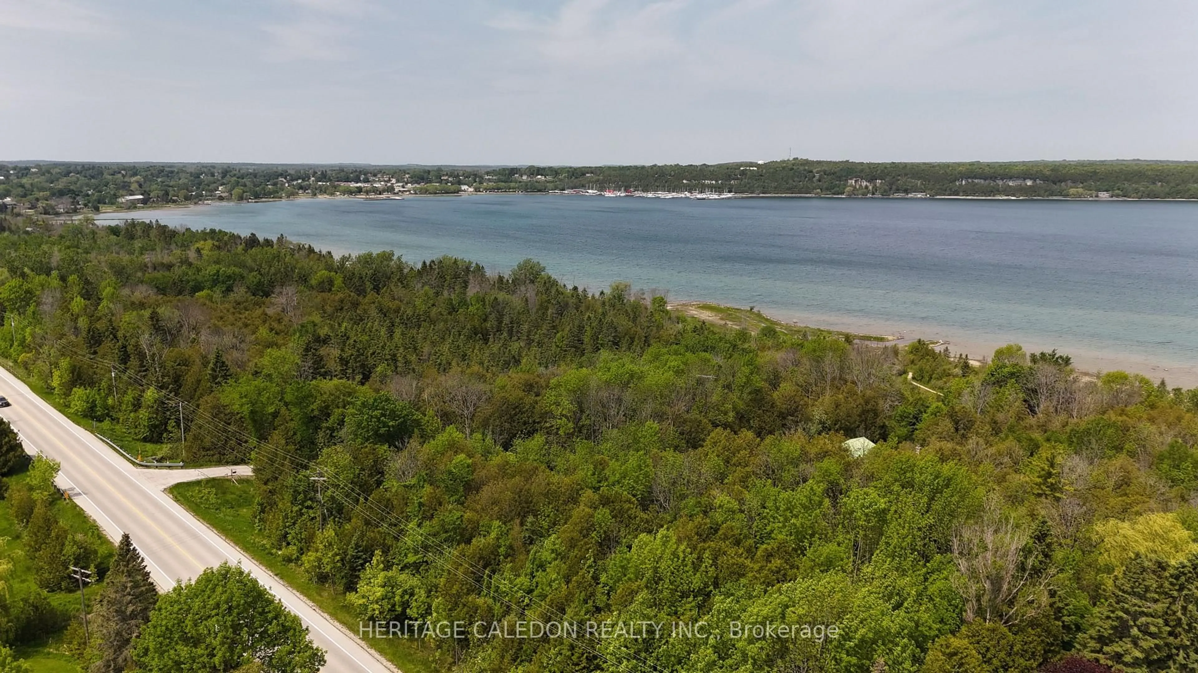 A pic from outside/outdoor area/front of a property/back of a property/a pic from drone, water/lake/river/ocean view for 501241 Grey Rd 1, Georgian Bluffs Ontario N0H 2T0