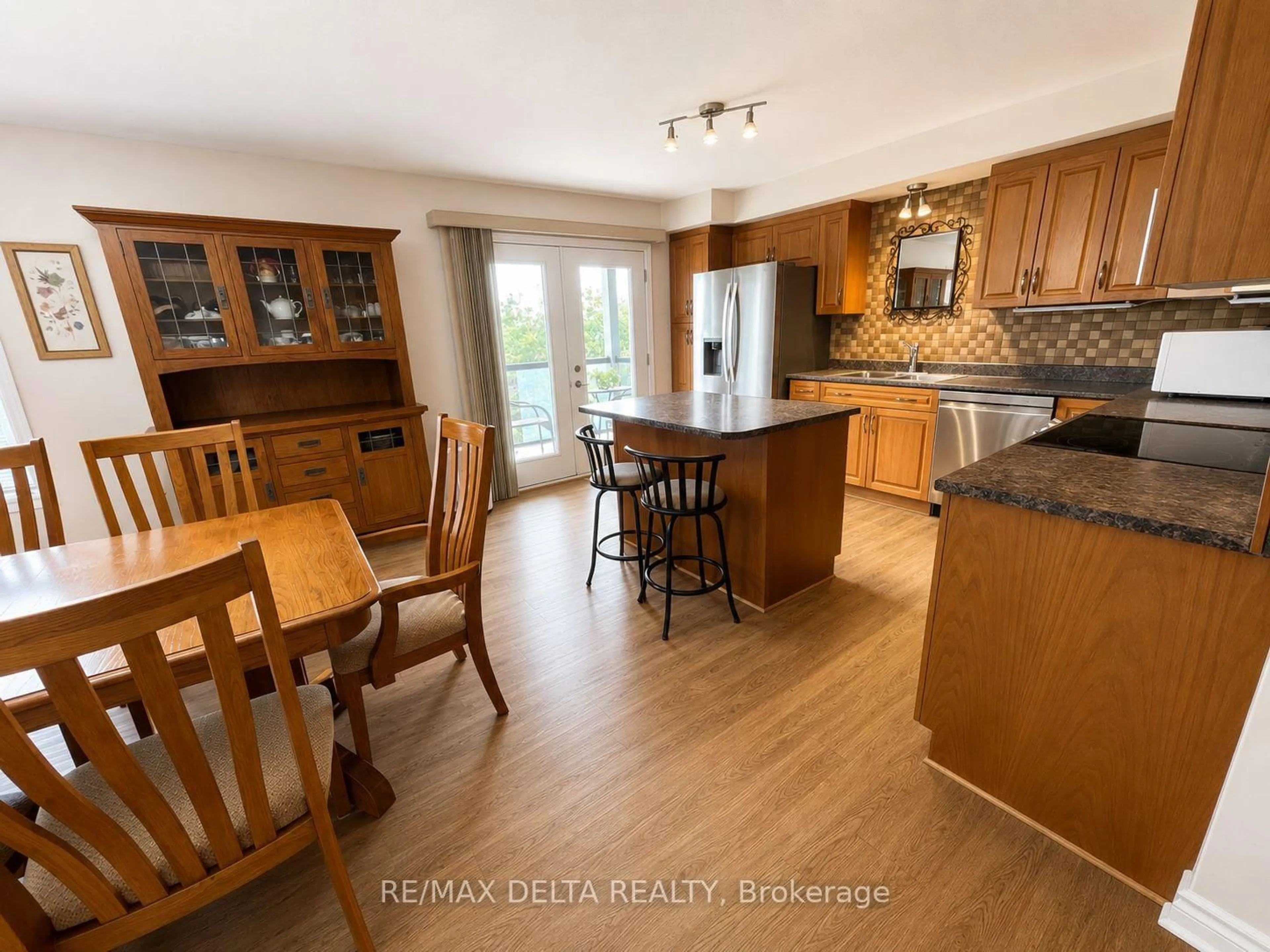 Open concept kitchen, wood/laminate floor for 755 Brébeuf St #301, Casselman Ontario K0A 1M0