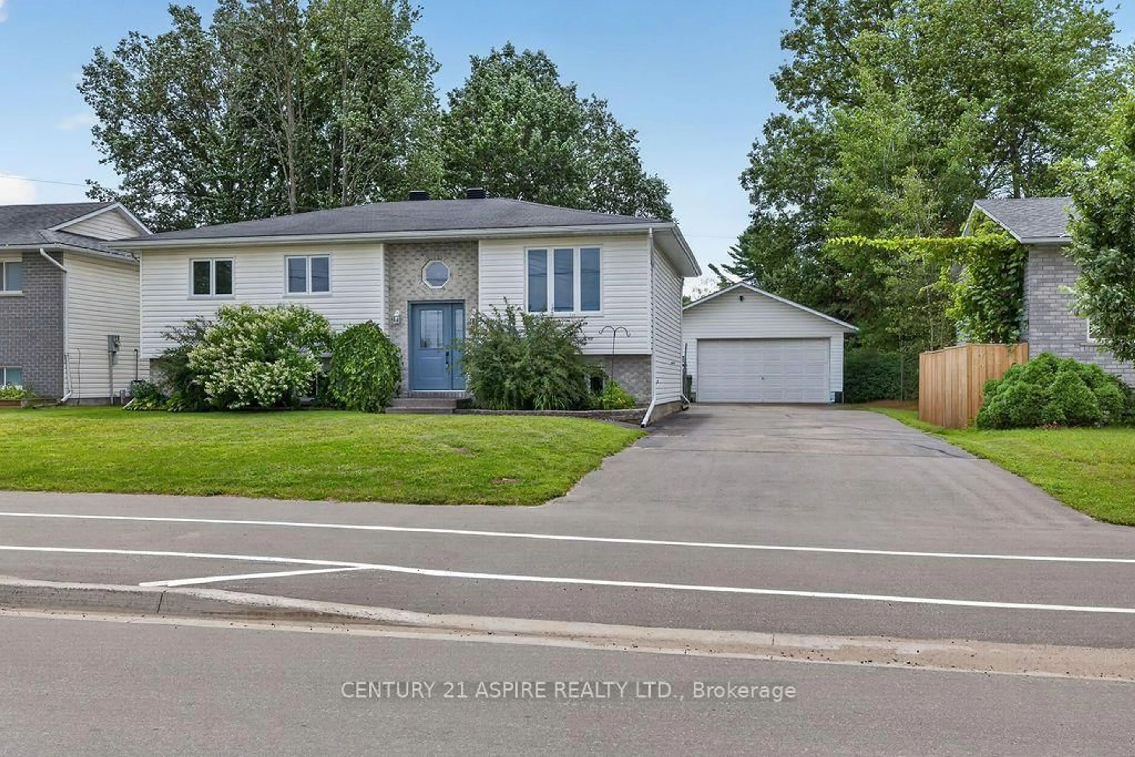 Home with vinyl exterior material, street for 50 Portage Rd, Petawawa Ontario K8H 3M8