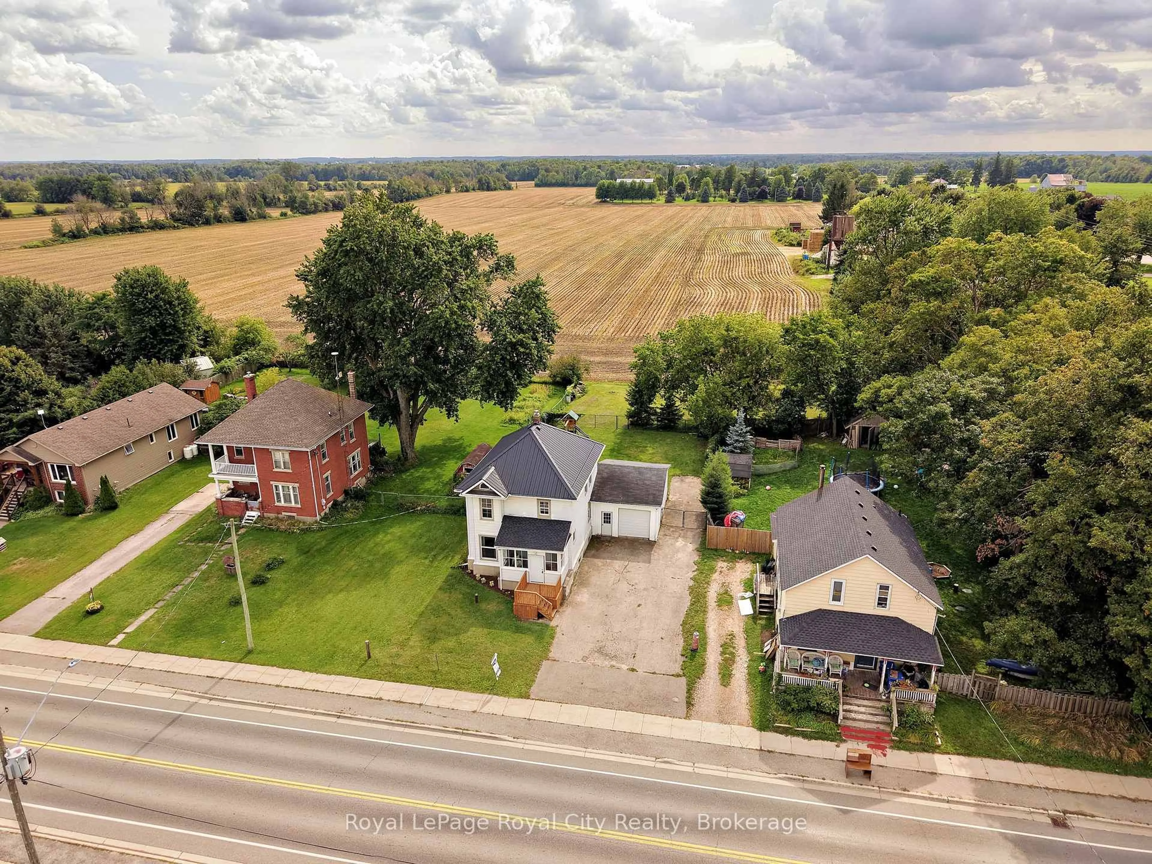 A pic from outside/outdoor area/front of a property/back of a property/a pic from drone, street for 9116 Highway #6, Wellington North Ontario N0G 2E0