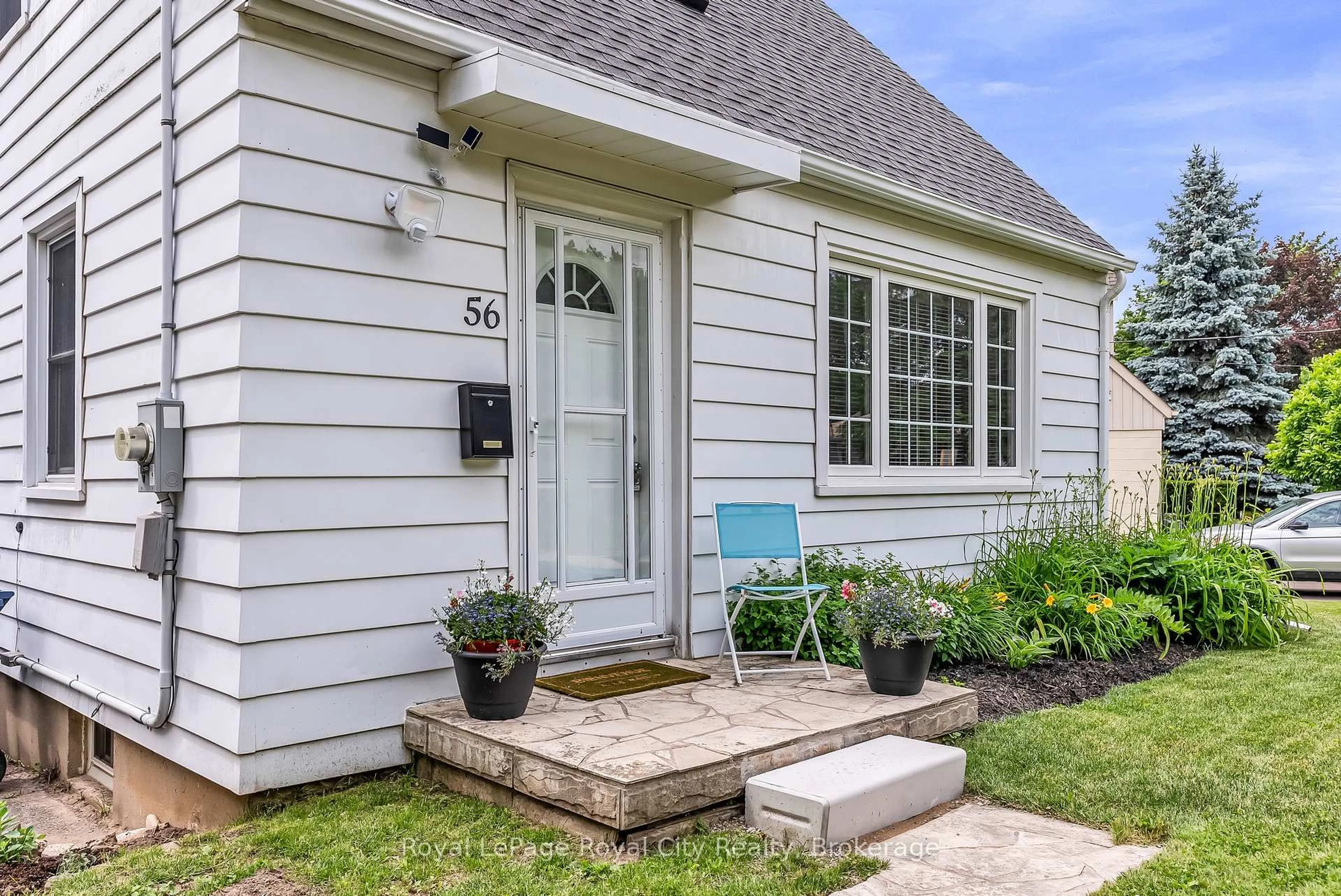 Home with vinyl exterior material, street for 56 Winston Cres, Guelph Ontario N1E 2K2