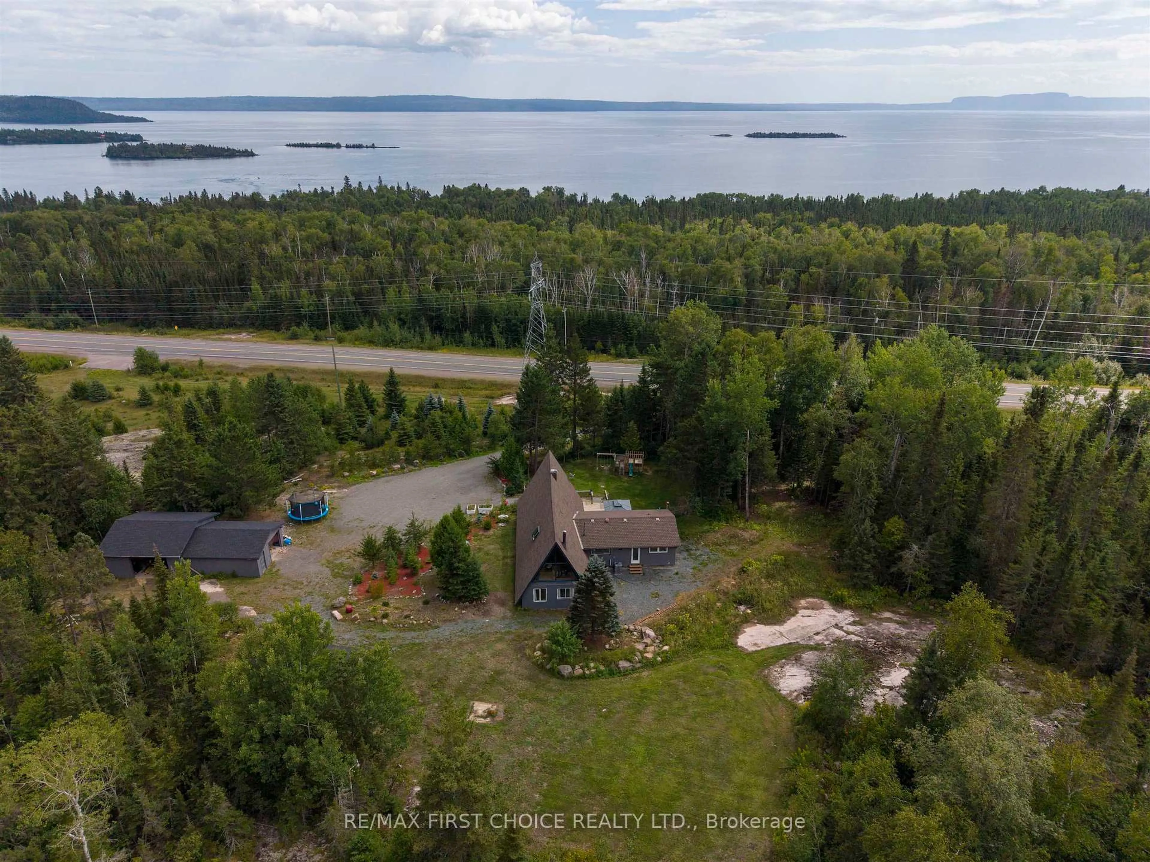 A pic from outside/outdoor area/front of a property/back of a property/a pic from drone, water/lake/river/ocean view for 1950 Lakeshore Dr, Shuniah Ontario P7A 0L3
