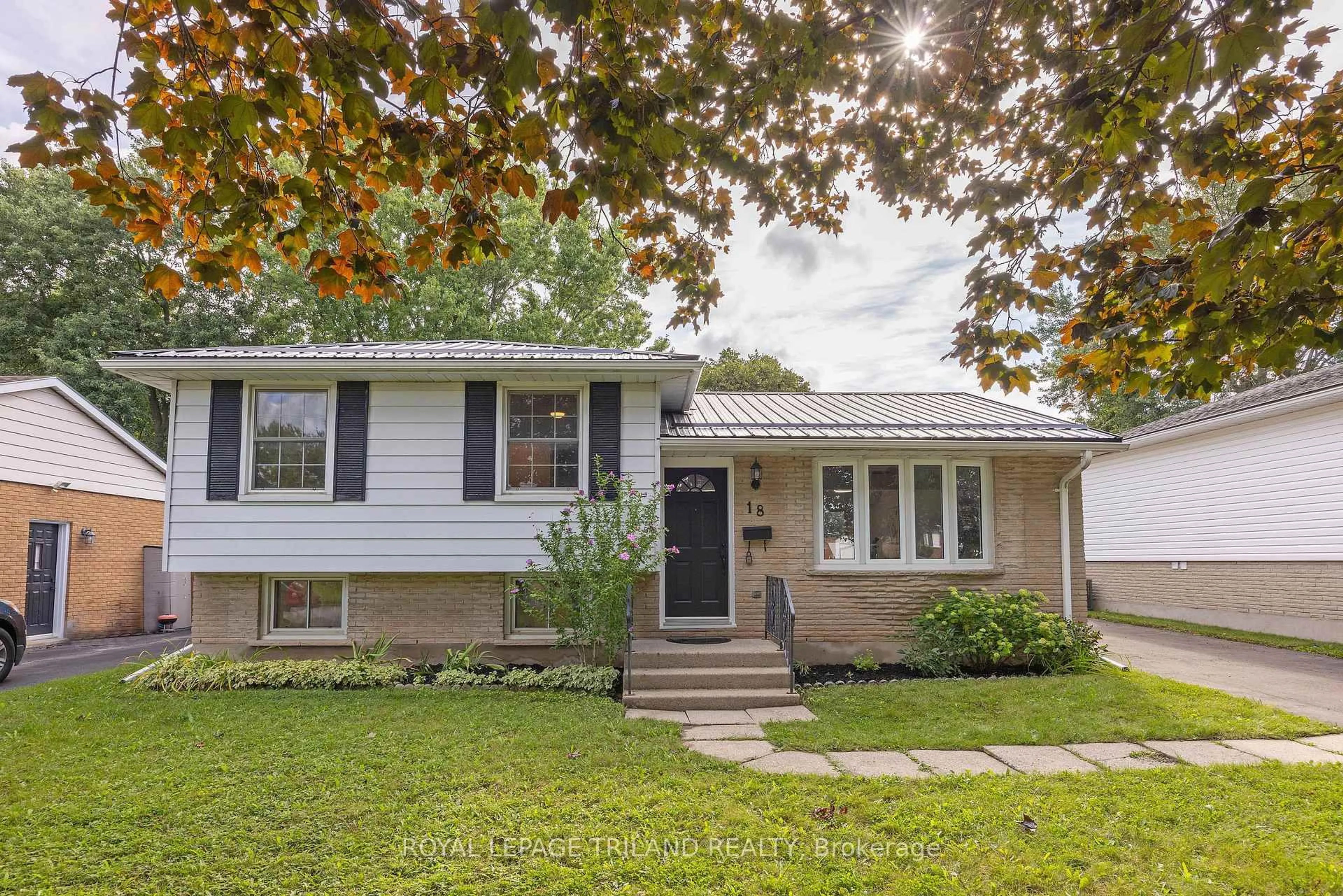 Home with vinyl exterior material, street for 18 Laurier Rd, St. Thomas Ontario N5P 3N7