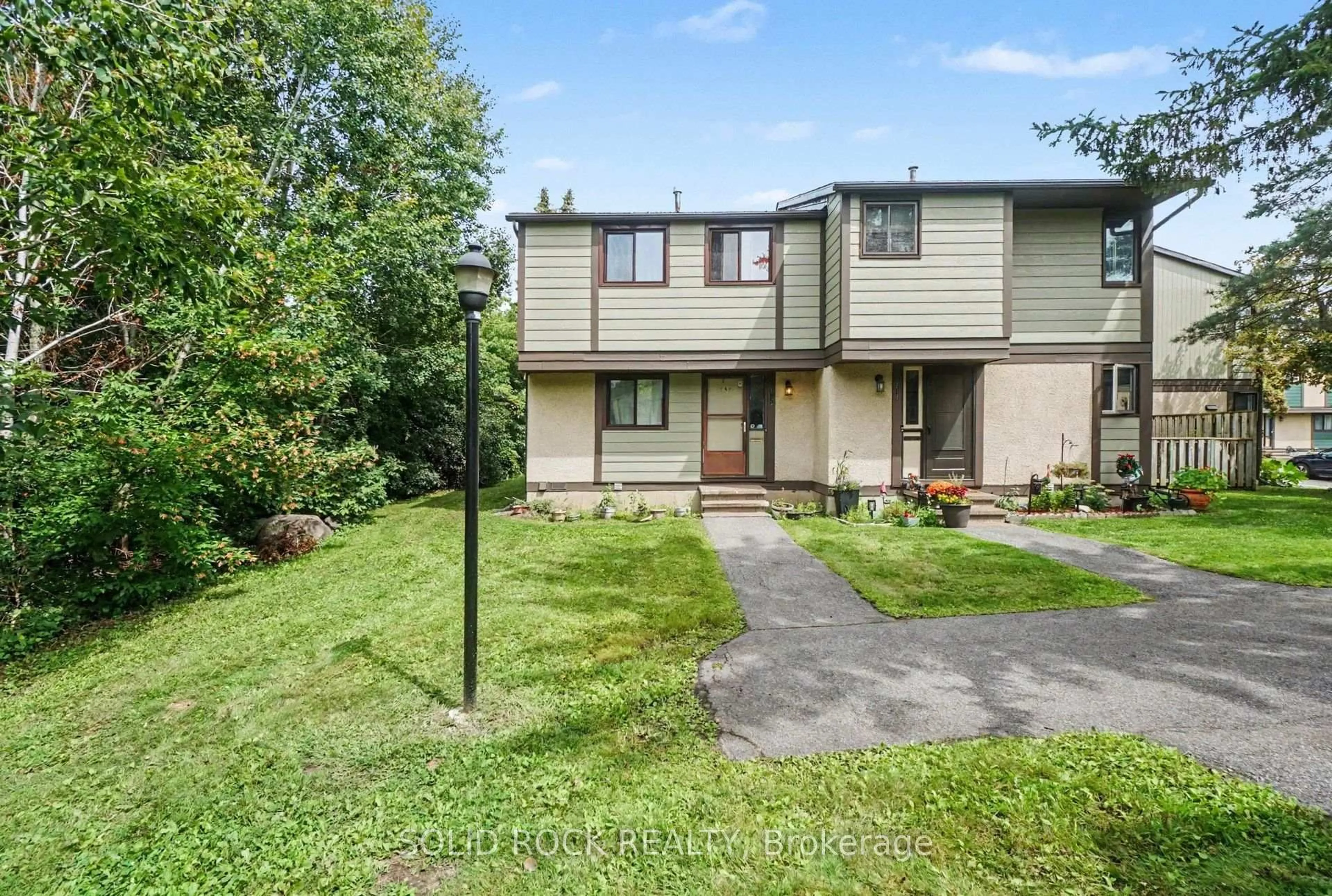 A pic from outside/outdoor area/front of a property/back of a property/a pic from drone, unknown for 1735 Meadowbrook Rd #71, Ottawa Ontario K1B 4W6