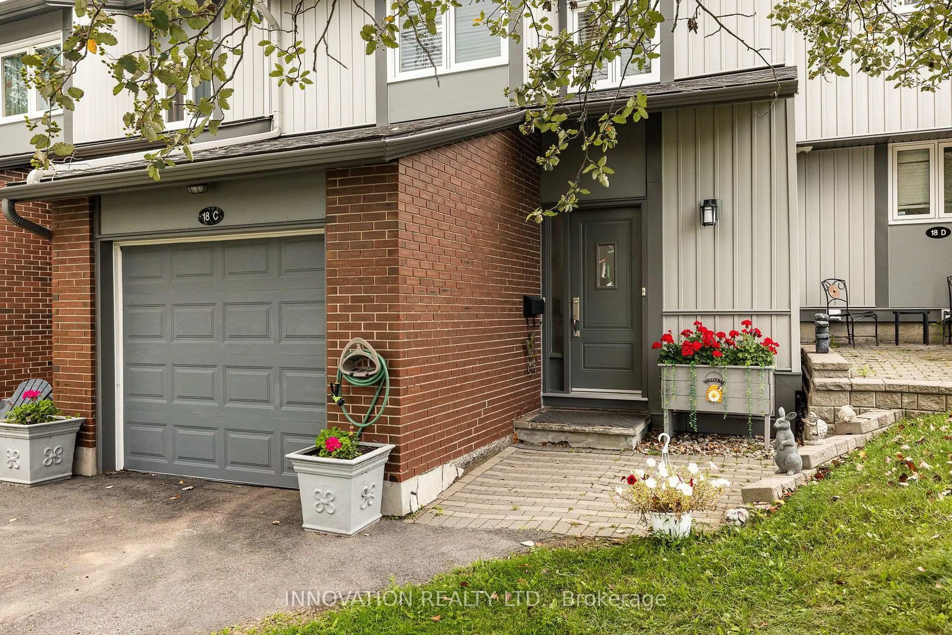 Home with brick exterior material, street for 18 Benlea Dr #C, Ottawa Ontario K2G 4A8