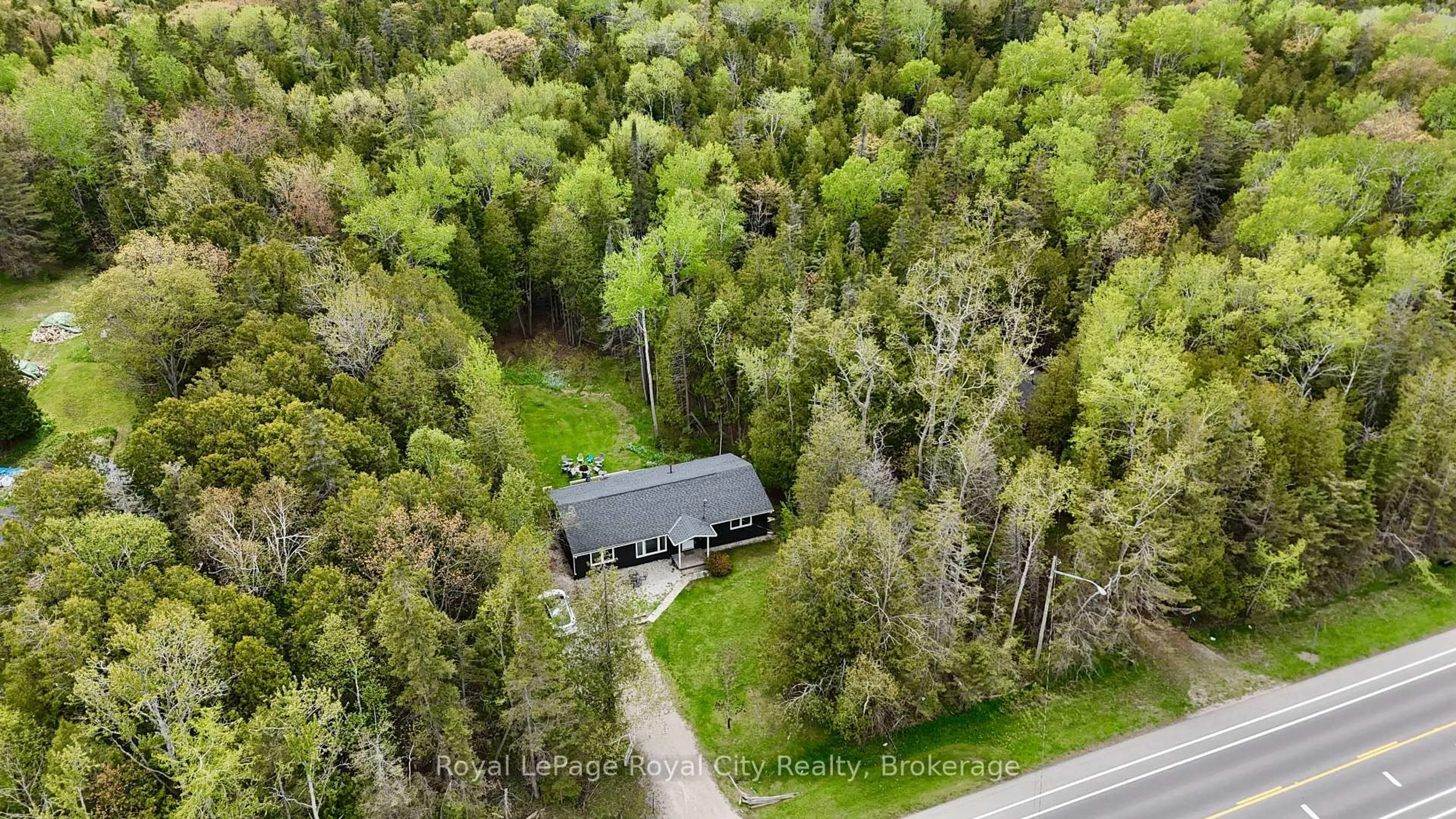 A pic from outside/outdoor area/front of a property/back of a property/a pic from drone, forest/trees view for 7221 6 Highway, Northern Bruce Peninsula Ontario N0H 2R0