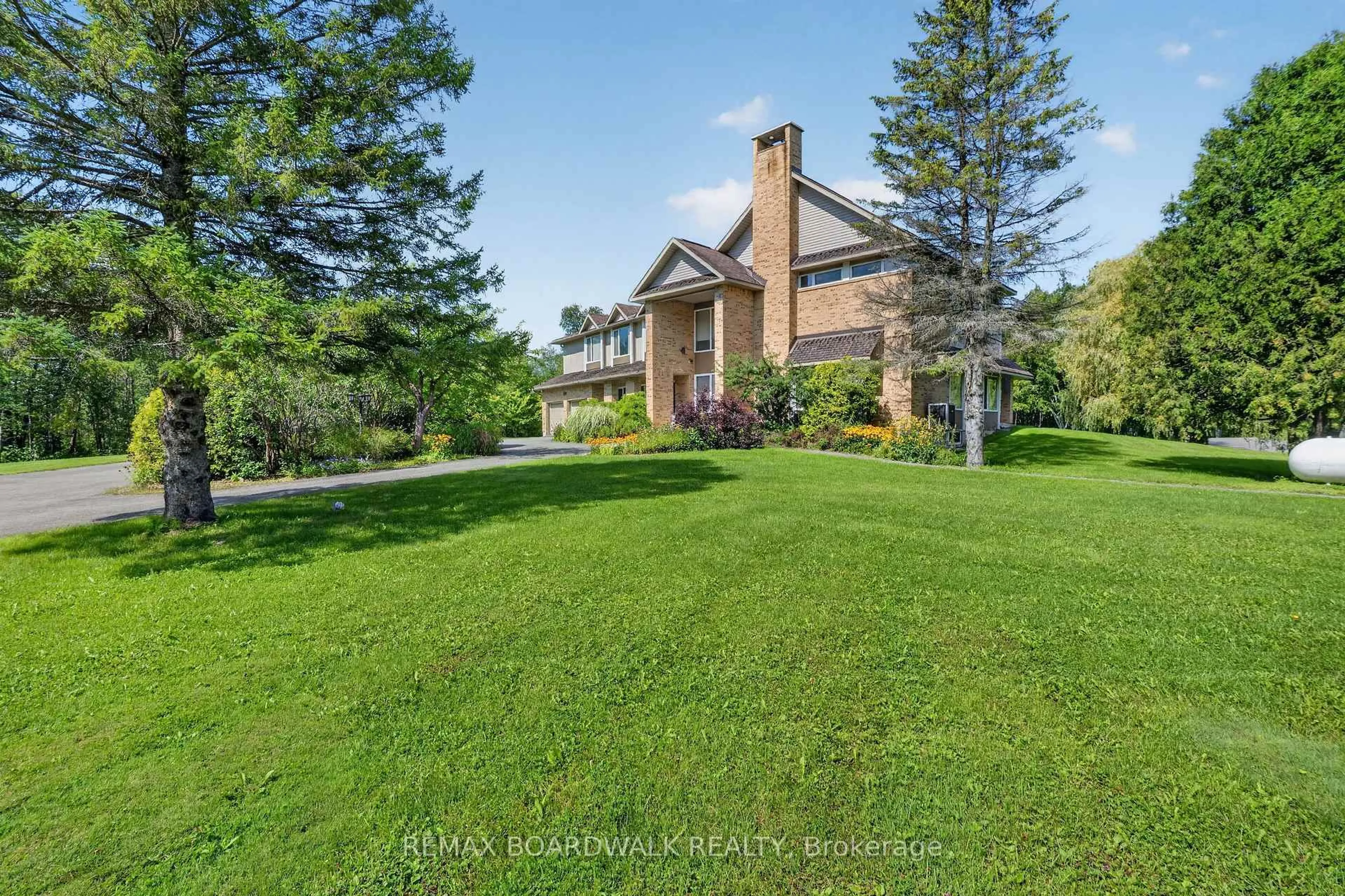 A pic from outside/outdoor area/front of a property/back of a property/a pic from drone, water/lake/river/ocean view for 2437 Devine Rd, Vars Ontario K0A 3H0