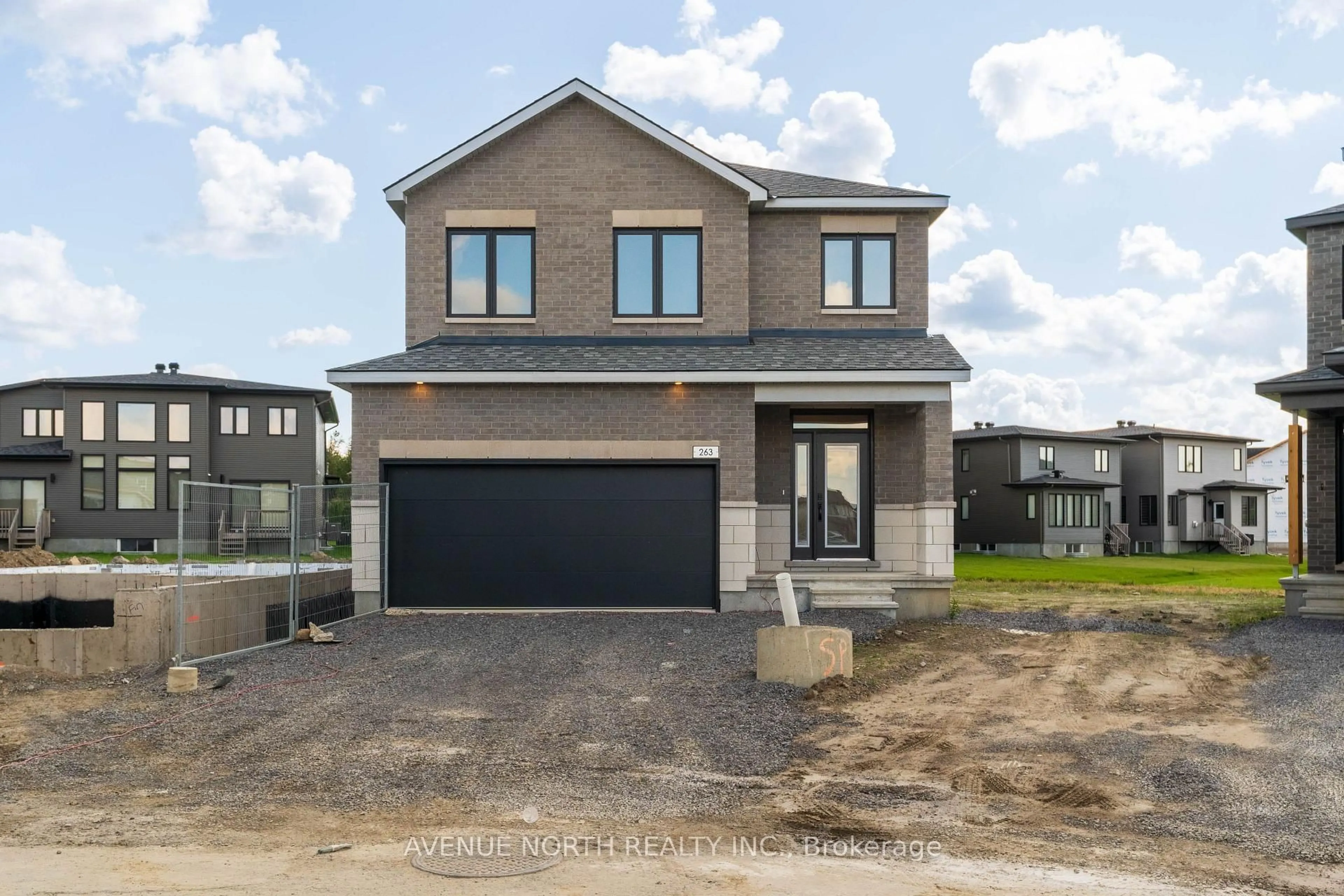 Home with brick exterior material, street for 263 Ginebik Way, Ottawa Ontario K1X 0H5
