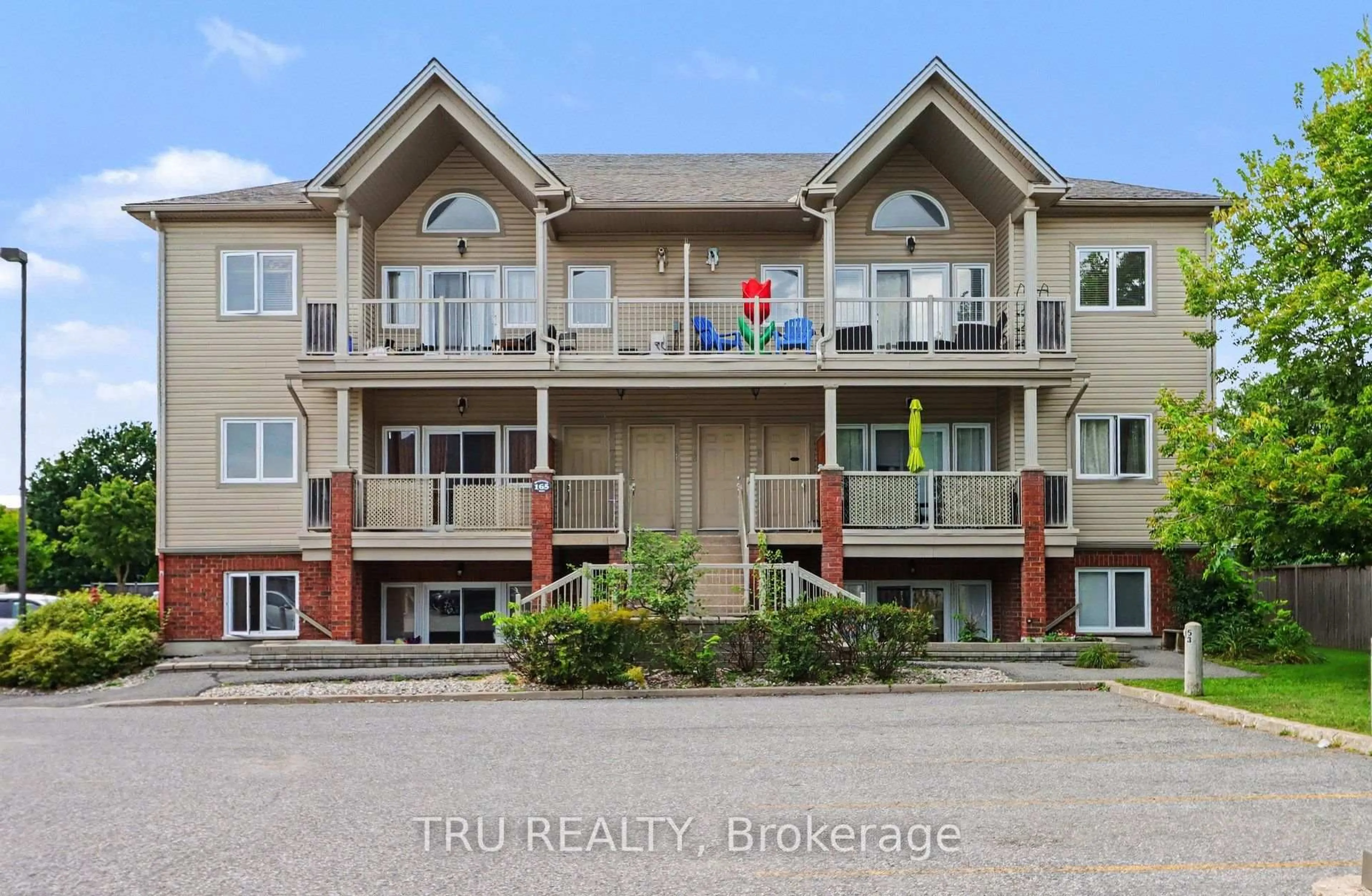 A pic from outside/outdoor area/front of a property/back of a property/a pic from drone, water/lake/river/ocean view for 165 Waterbridge Dr #7, Ottawa Ontario K2G 7G3