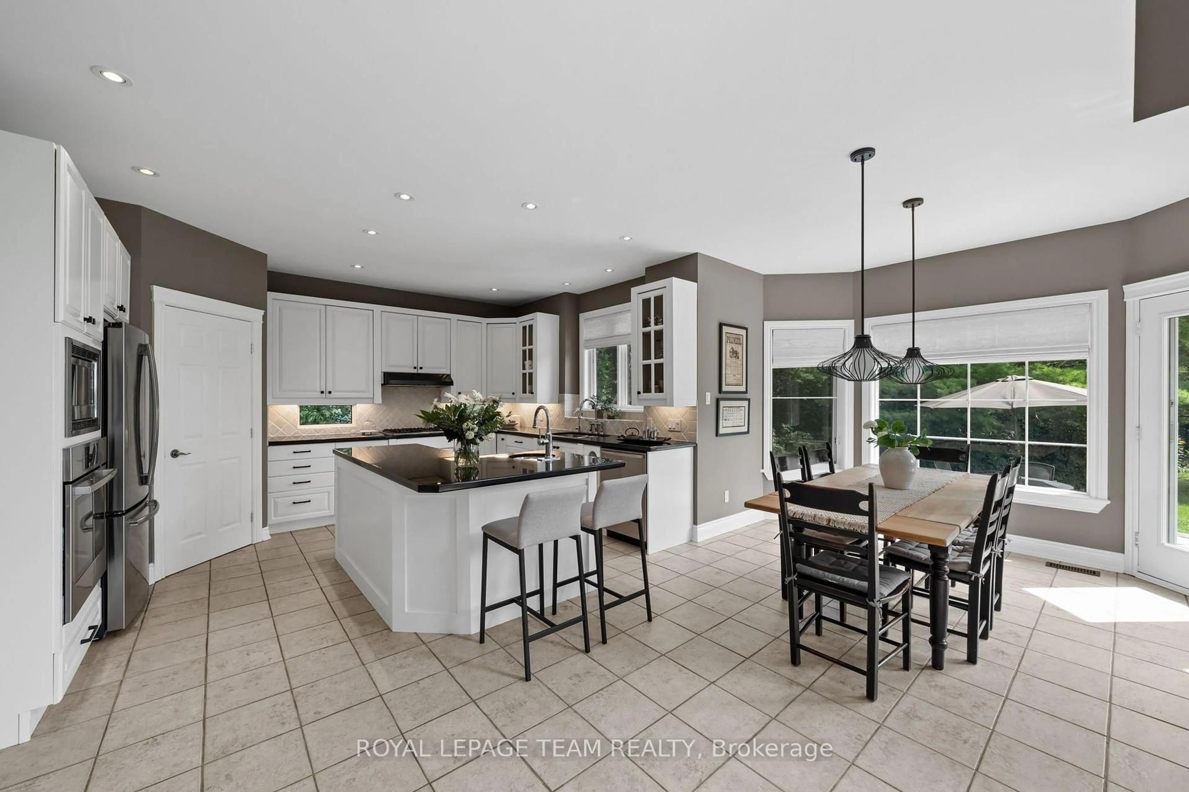 Open concept kitchen, ceramic/tile floor for 1518 Monaghan Lane, Ottawa Ontario K2W 1B4