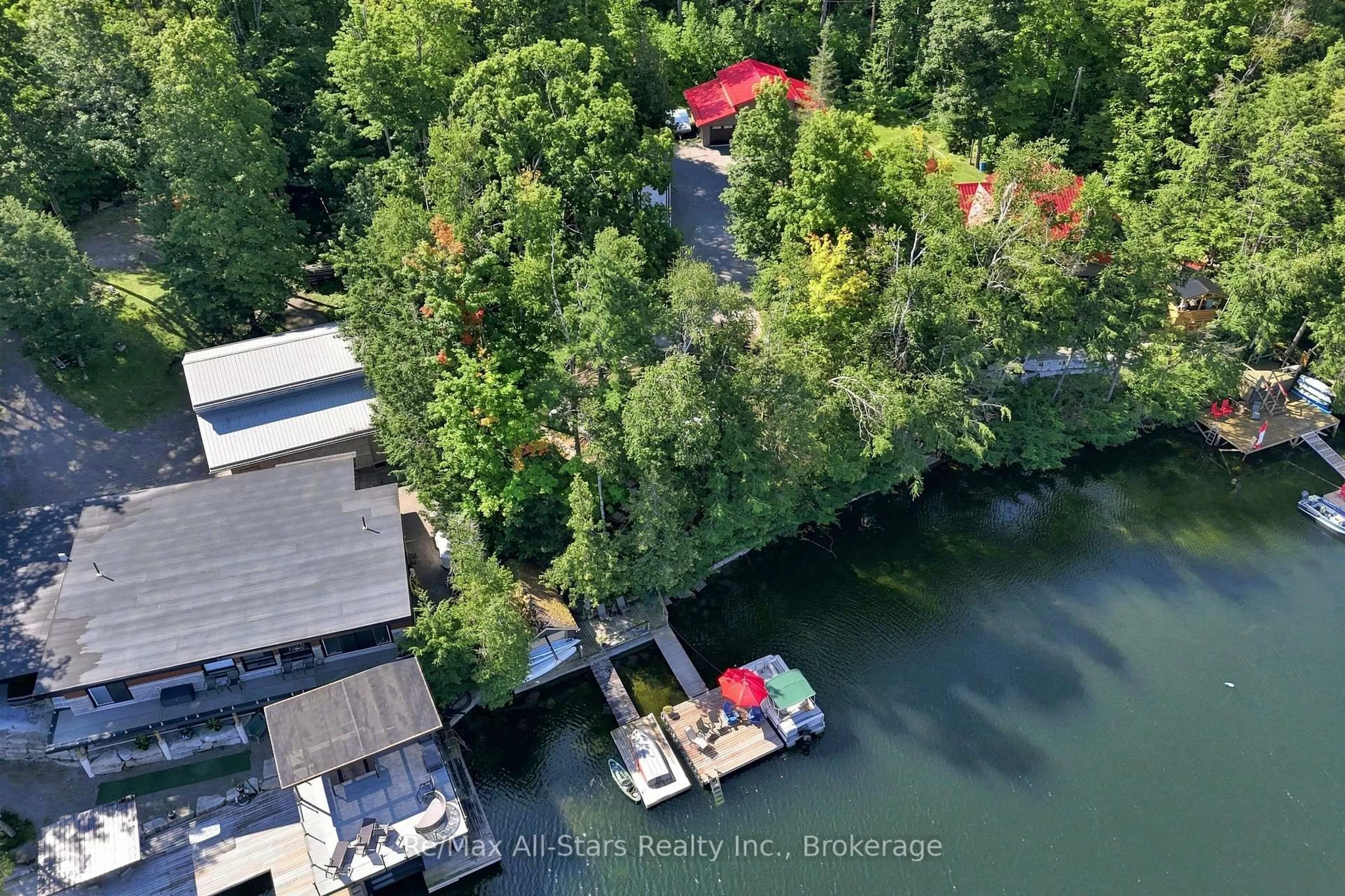 A pic from outside/outdoor area/front of a property/back of a property/a pic from drone, water/lake/river/ocean view for 1561 Crystal Lake, Trent Lakes Ontario K0M 2A0