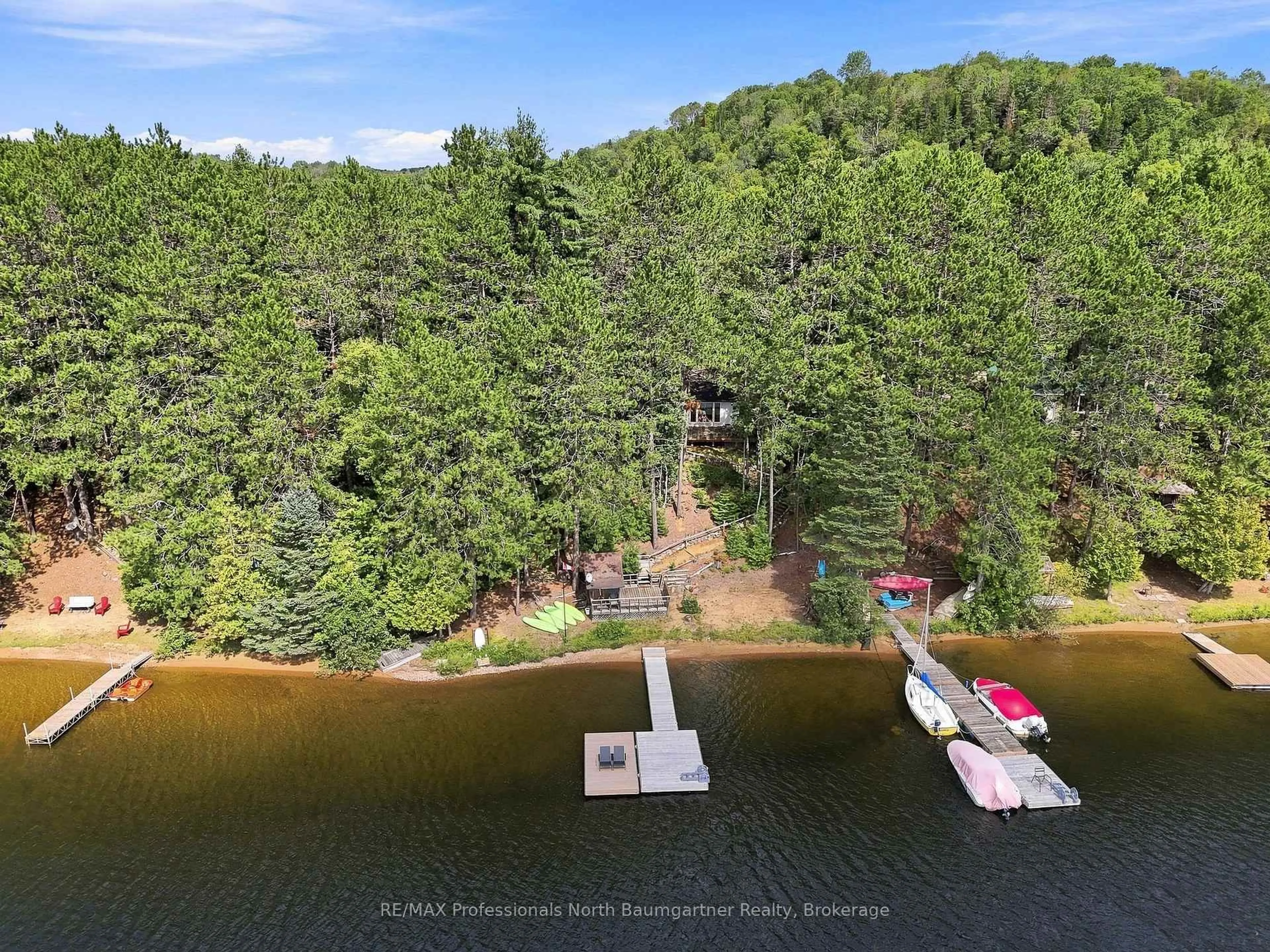 A pic from outside/outdoor area/front of a property/back of a property/a pic from drone, water/lake/river/ocean view for 1110 Edward Sanderson Rd, Highlands East Ontario K0L 2Y0