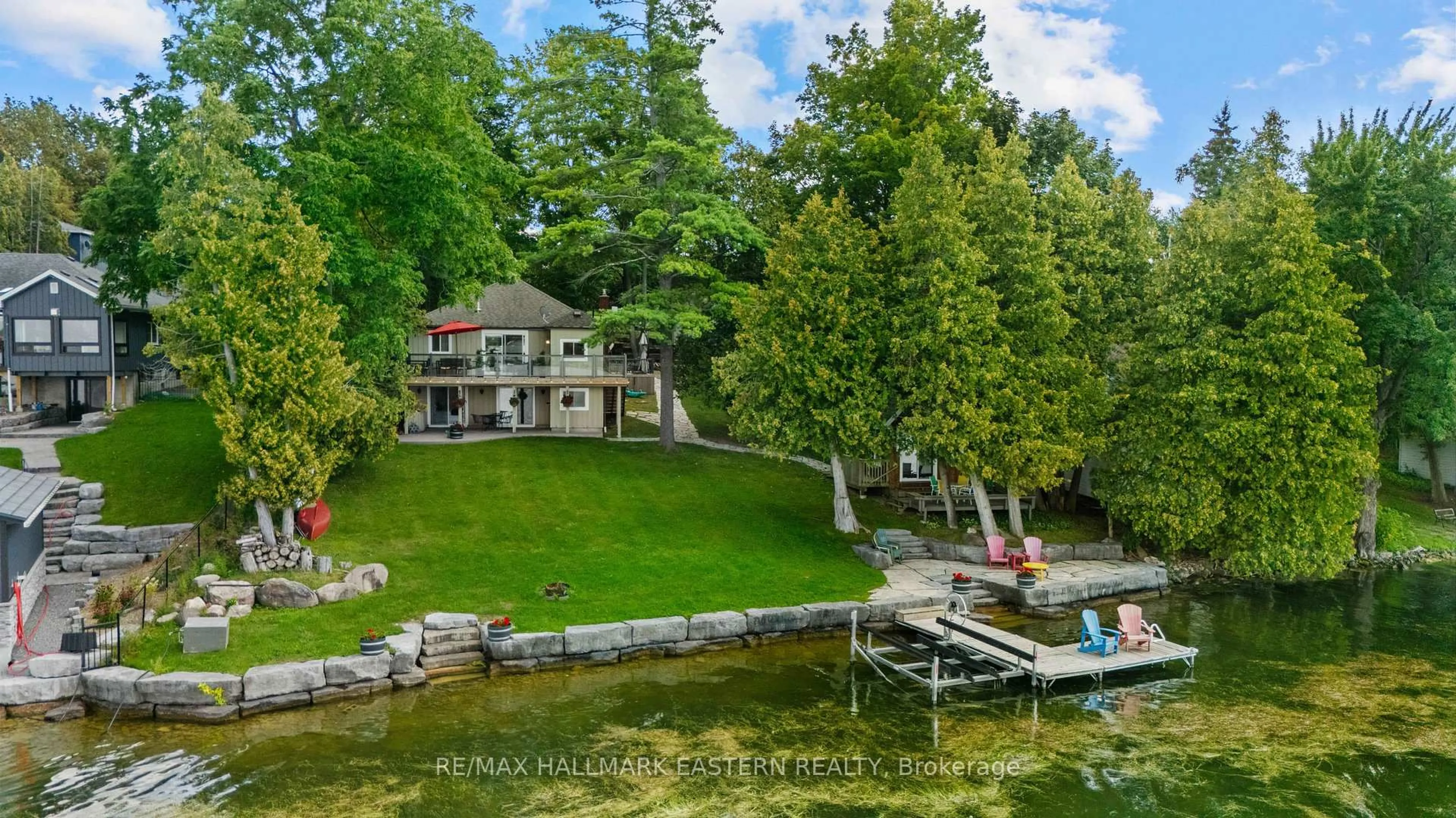 A pic from outside/outdoor area/front of a property/back of a property/a pic from drone, water/lake/river/ocean view for 1714 Poplar Point Rd, Selwyn Ontario K9J 6X5