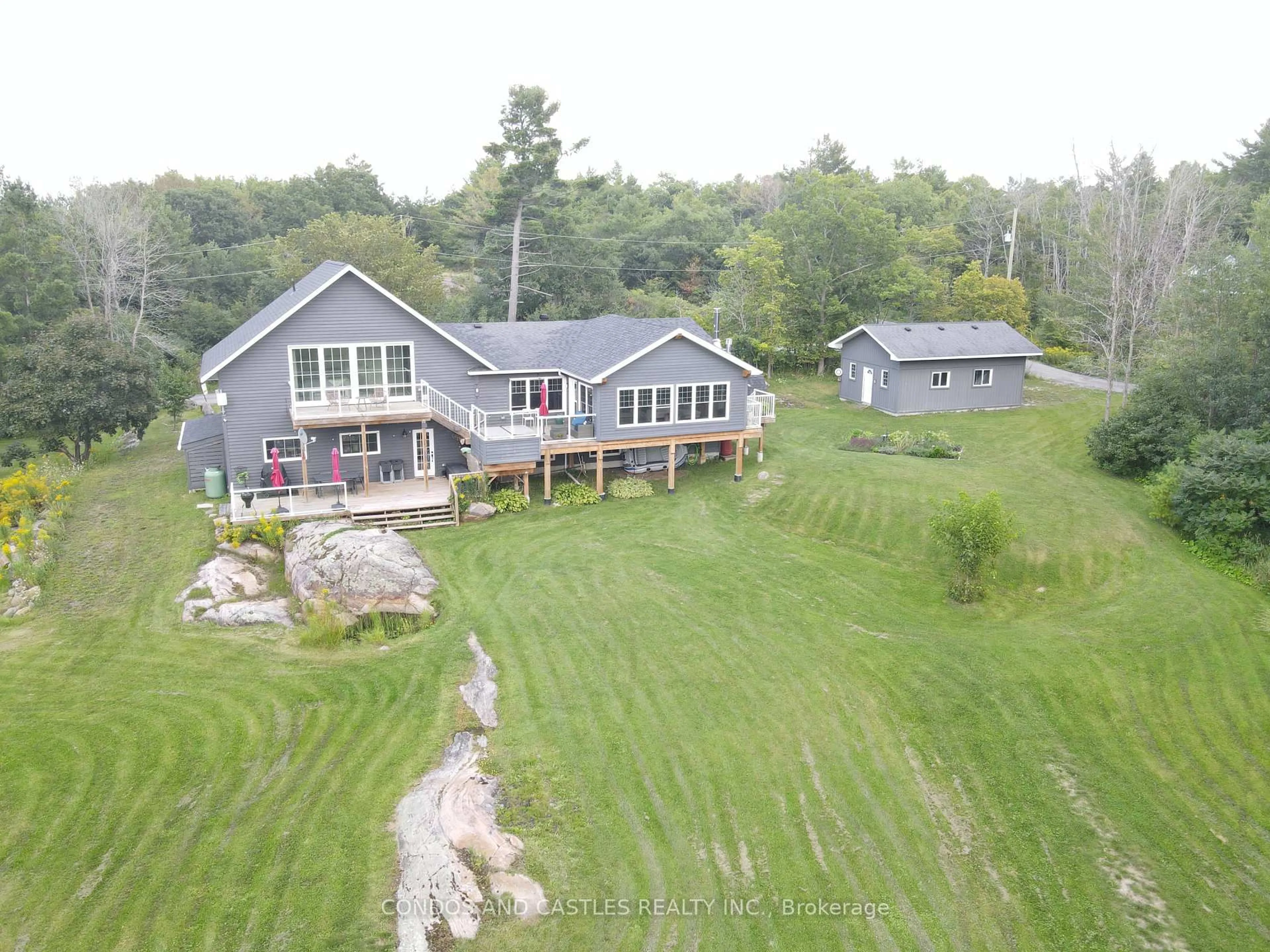 A pic from outside/outdoor area/front of a property/back of a property/a pic from drone, water/lake/river/ocean view for 9 Osprey Way, Georgian Bay Ontario L0K 1S0