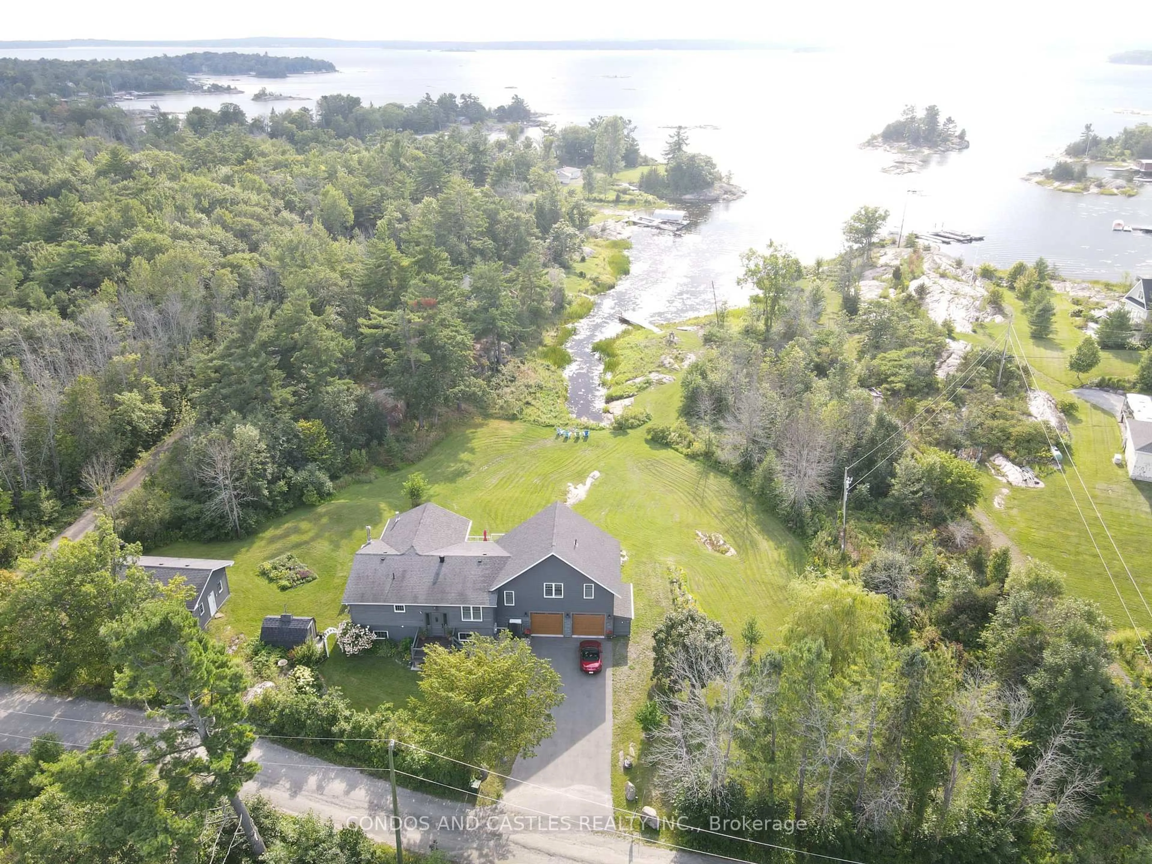 A pic from outside/outdoor area/front of a property/back of a property/a pic from drone, water/lake/river/ocean view for 9 Osprey Way, Georgian Bay Ontario L0K 1S0