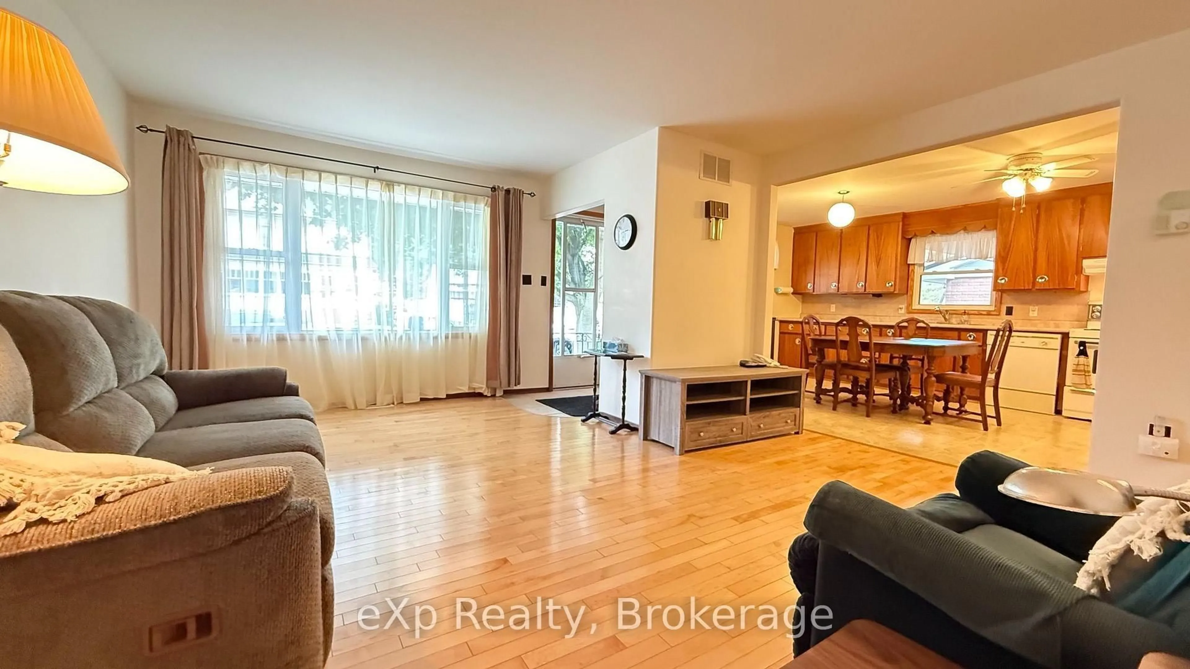 Living room with furniture, wood/laminate floor for 53 Maple St, North Huron Ontario N0G 2W0