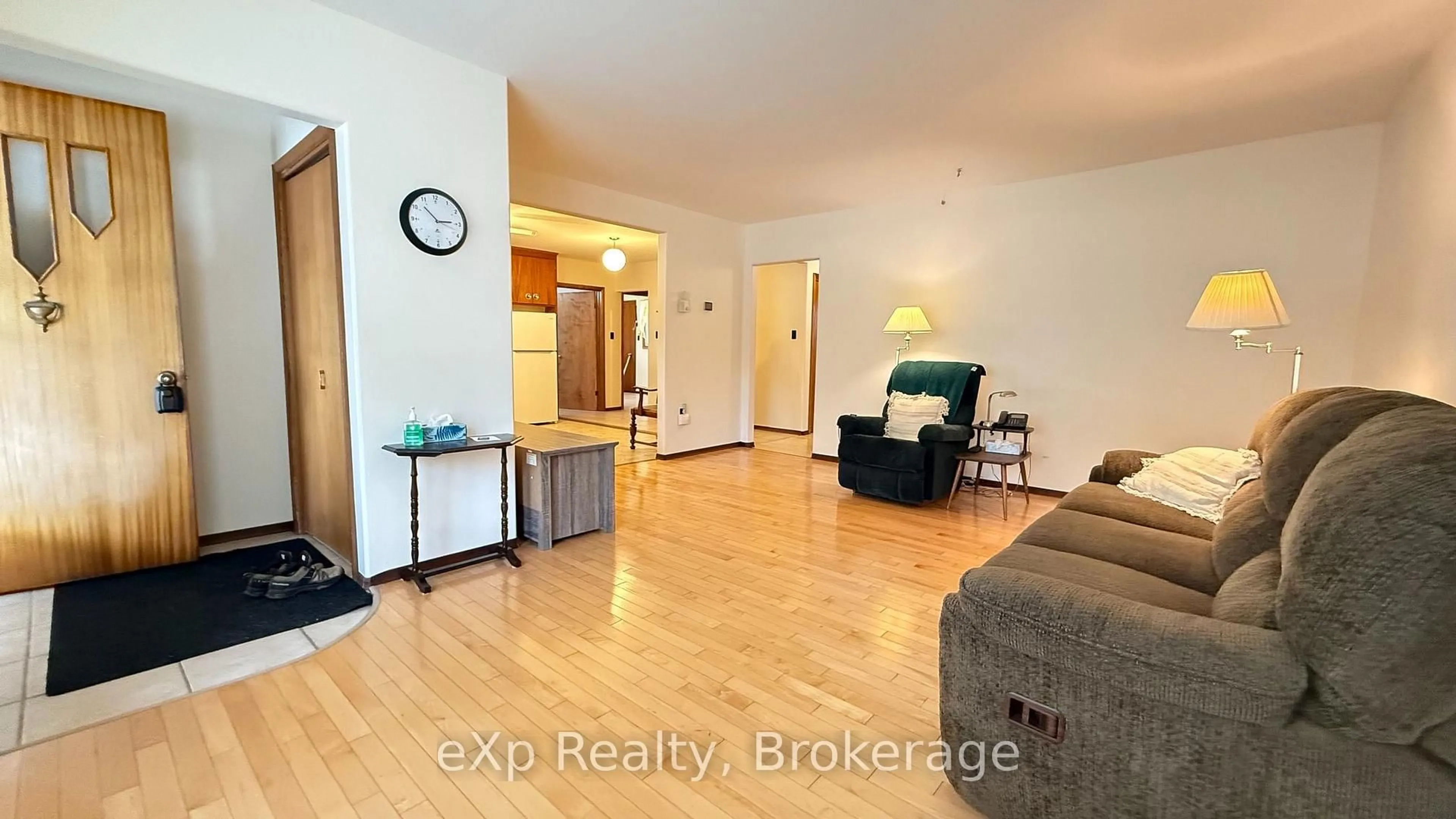 Living room with furniture, wood/laminate floor for 53 Maple St, North Huron Ontario N0G 2W0