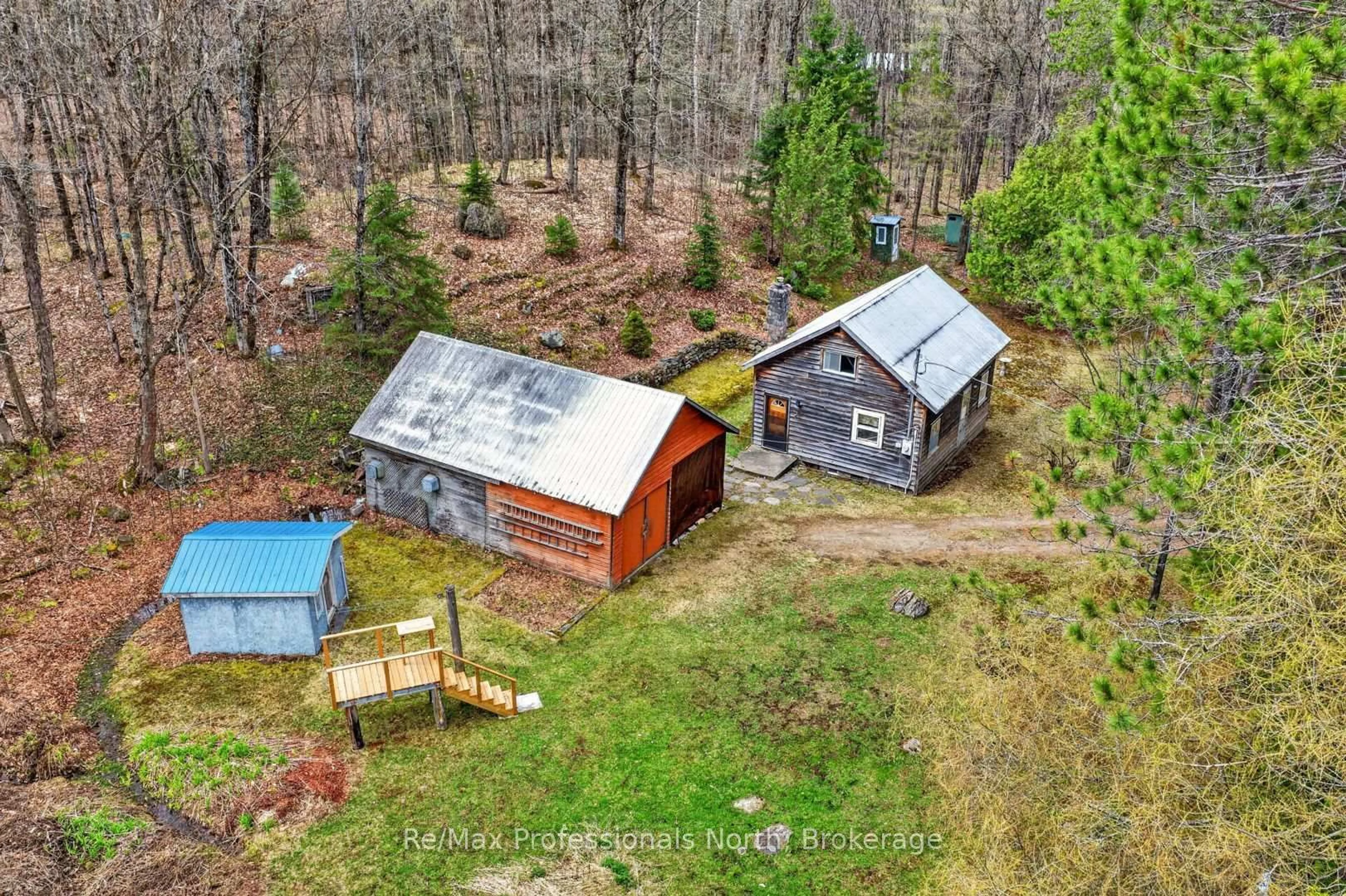 A pic from outside/outdoor area/front of a property/back of a property/a pic from drone, forest/trees view for 3640 Muskoka Rd 117 Rd, Lake of Bays Ontario P0B 1A0