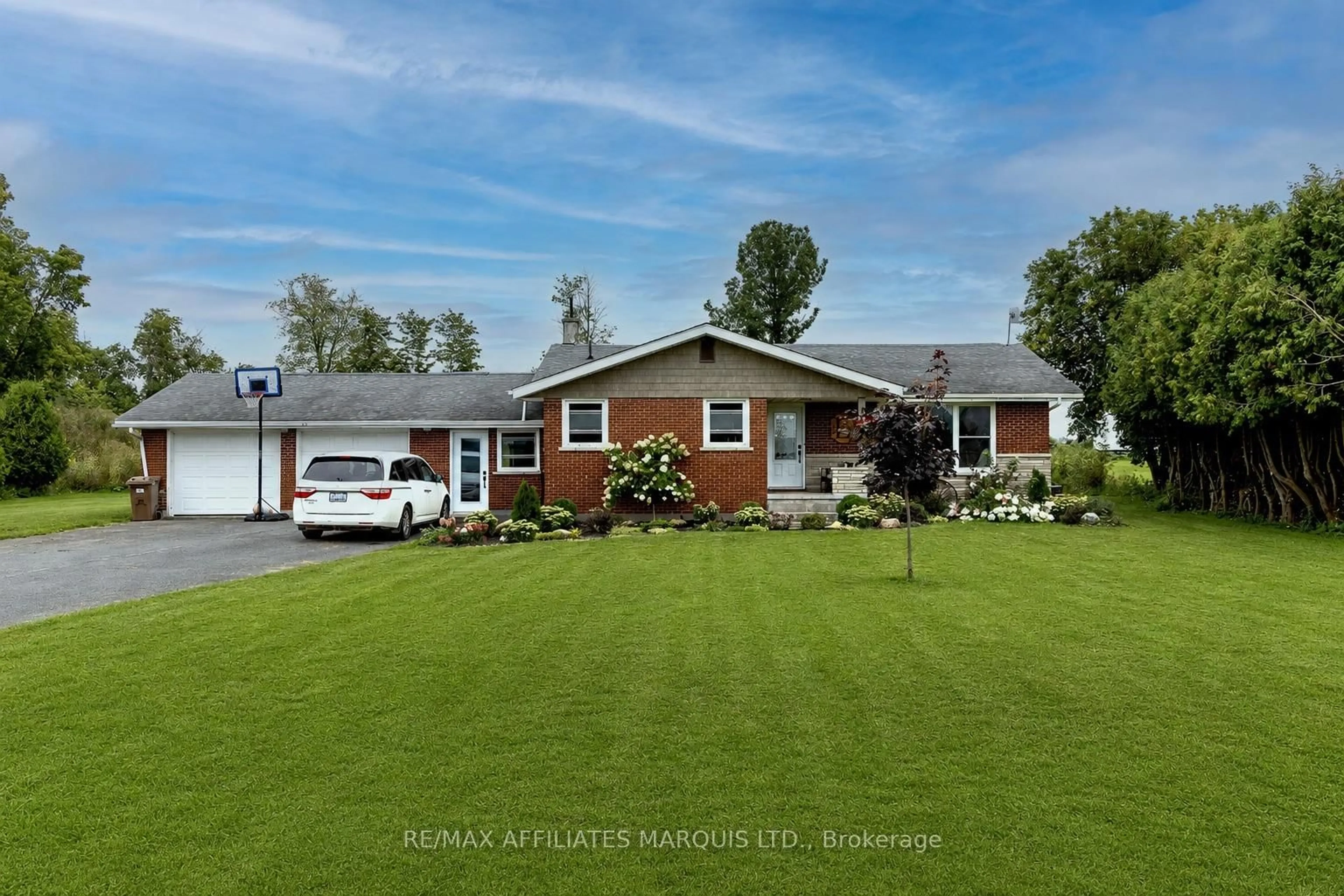 A pic from outside/outdoor area/front of a property/back of a property/a pic from drone, street for 12662 County Road 18 Rd, South Dundas Ontario K0C 2H0