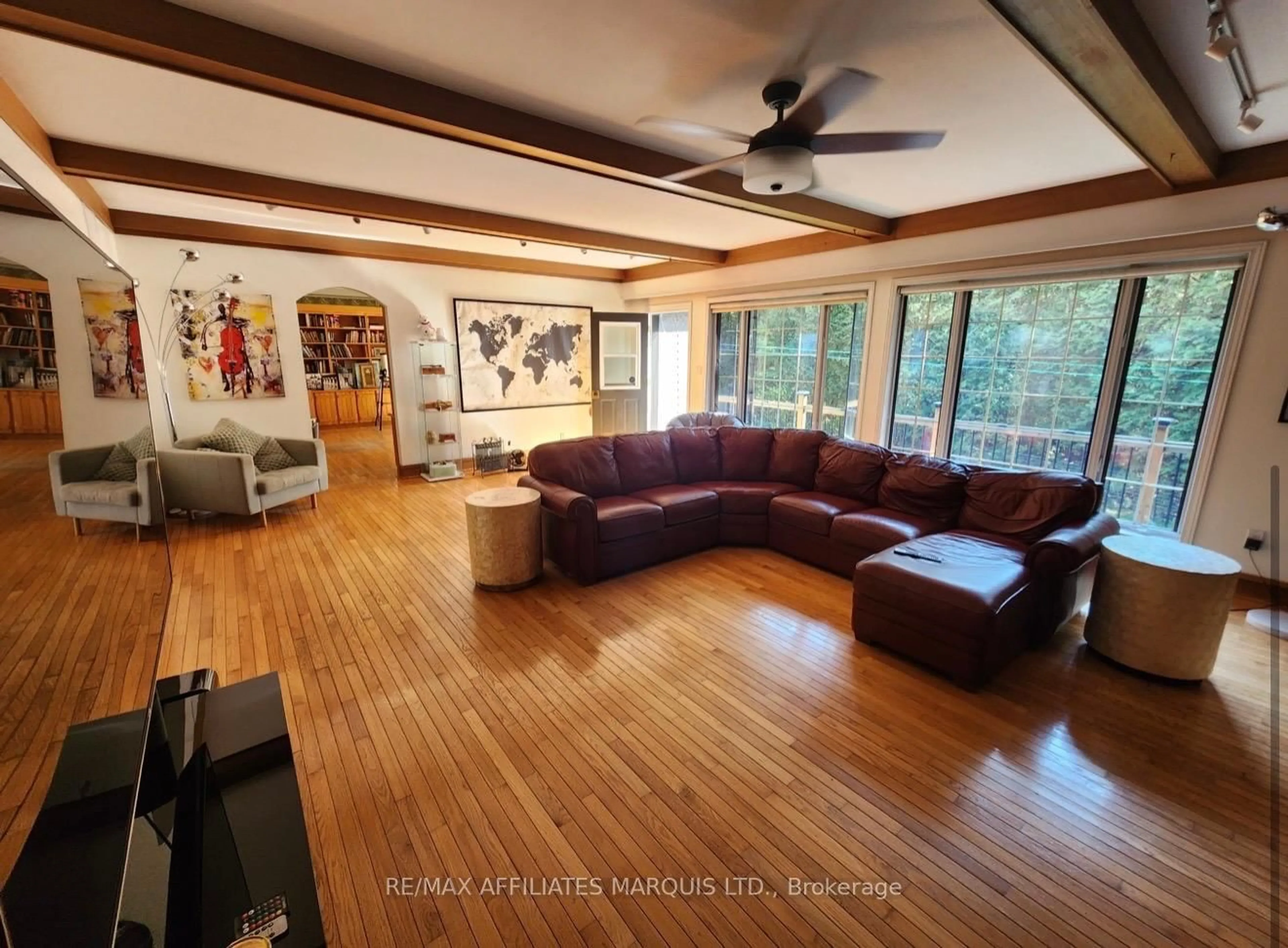 Living room with furniture, wood/laminate floor for 4466 County 34 Rd, South Glengarry Ontario K0C 1L0