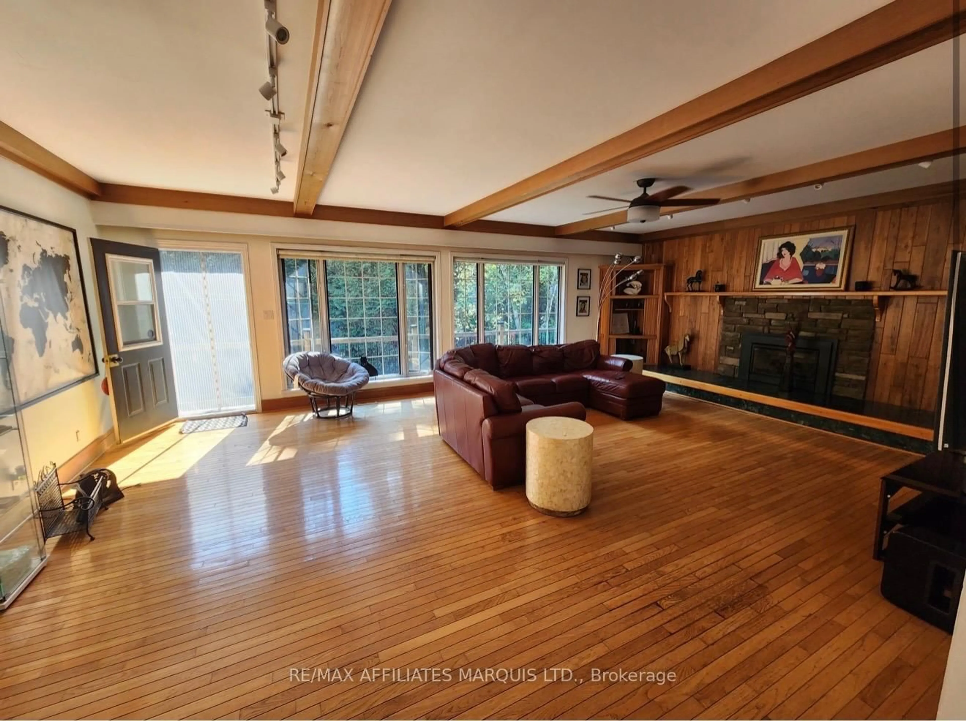 Living room with furniture, wood/laminate floor for 4466 County 34 Rd, South Glengarry Ontario K0C 1L0