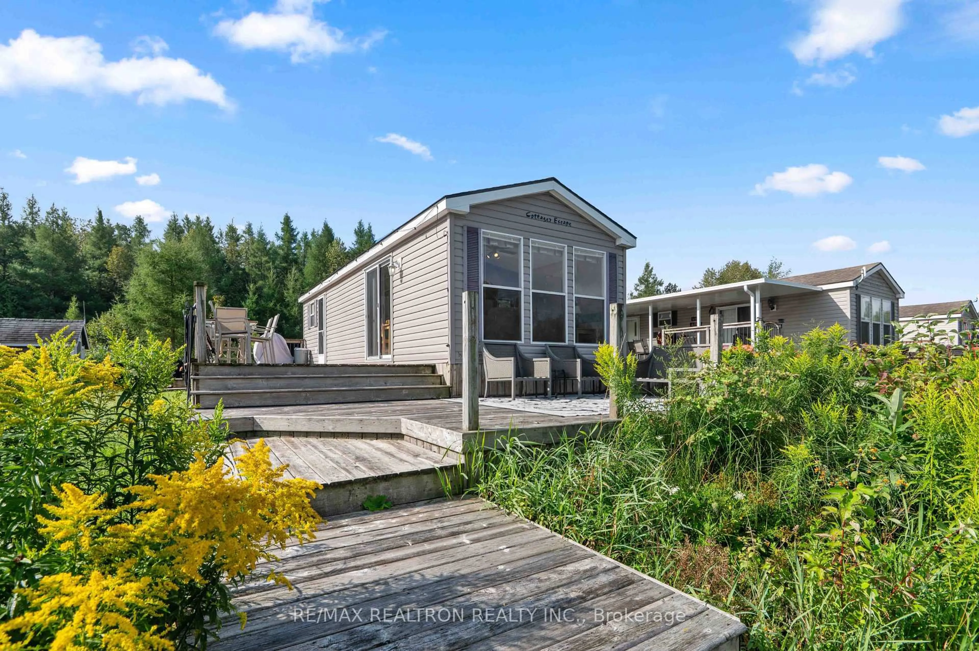 A pic from outside/outdoor area/front of a property/back of a property/a pic from drone, unknown for 7489 SIDEROAD 5 #T102, Wellington North Ontario N0G 2L0