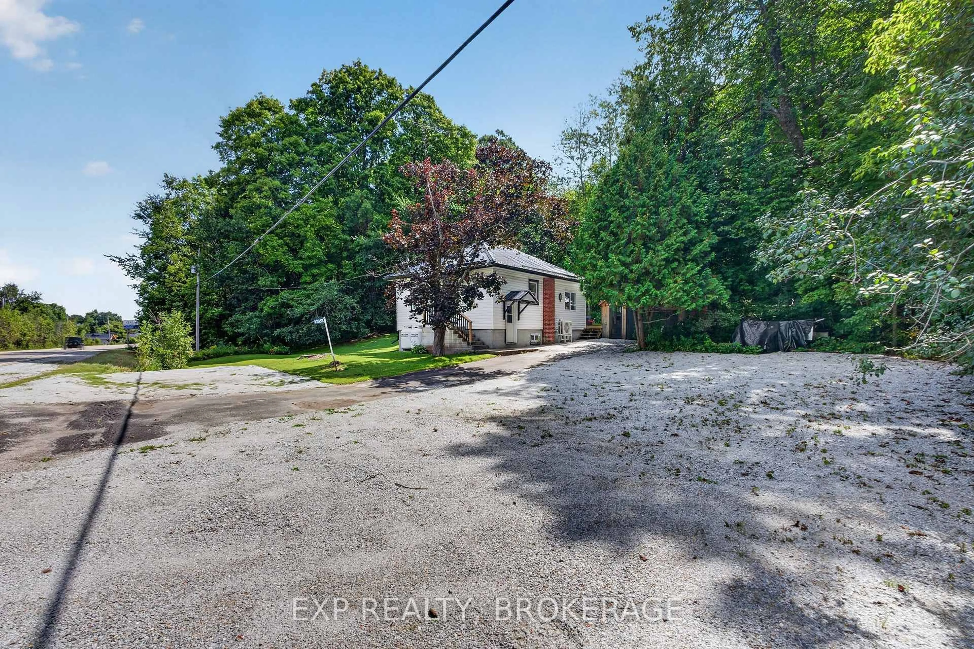 A pic from outside/outdoor area/front of a property/back of a property/a pic from drone, street for 22053 HIGHWAY 7, Maberly Ontario K0H 2B0